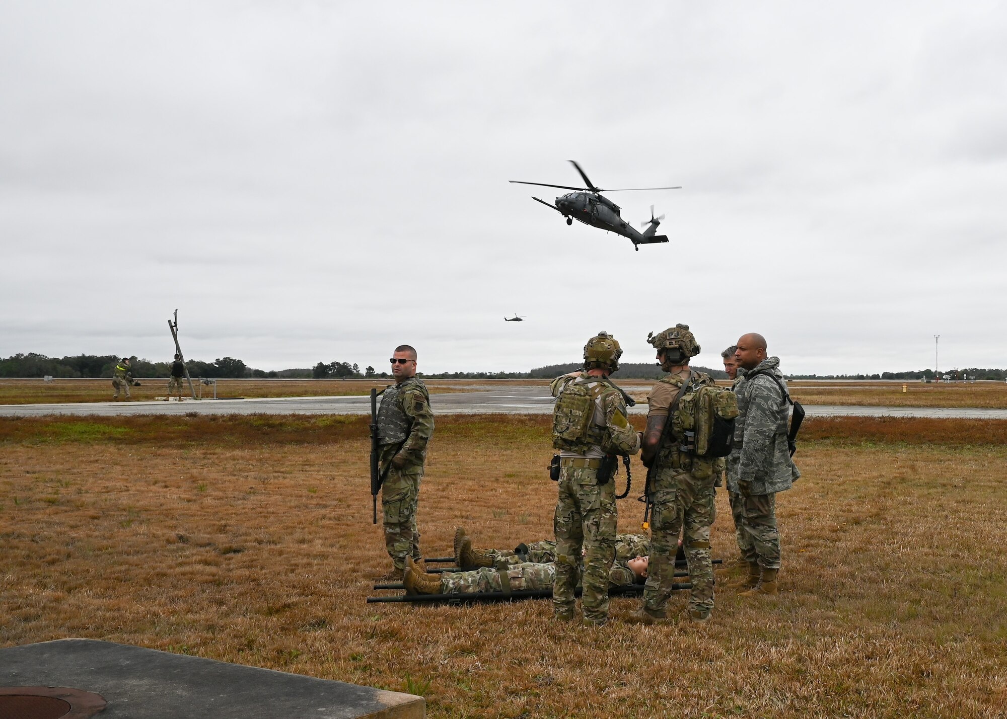 Airmen from the 920th Rescue Wing await the arrival of an HH-60G Pave Hawk helicopter during the wing’s FURY HORIZON 22 exercise Feb. 5, 2022. The HORIZON series of wing exercises are held throughout the year at group and wing levels. They bring together the combined knowledge of the entire wing to focus tactics on executing their mission anywhere in the world at a moment’s notice. (U.S. Air Force photo by Capt. Amanda Ling)