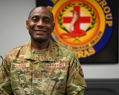 U.S. Air Force Col. Derek Larbie, 17th Medical Group commander, poses for a photo at the Ross Clinic, Goodfellow Air Force Base, Texas, Feb. 17, 2022. Larbie was born in Ghana, West Africa, and has been serving in the Air Force for 24 years. (U.S. Air Force photo by, Senior Airman Michael Bowman)