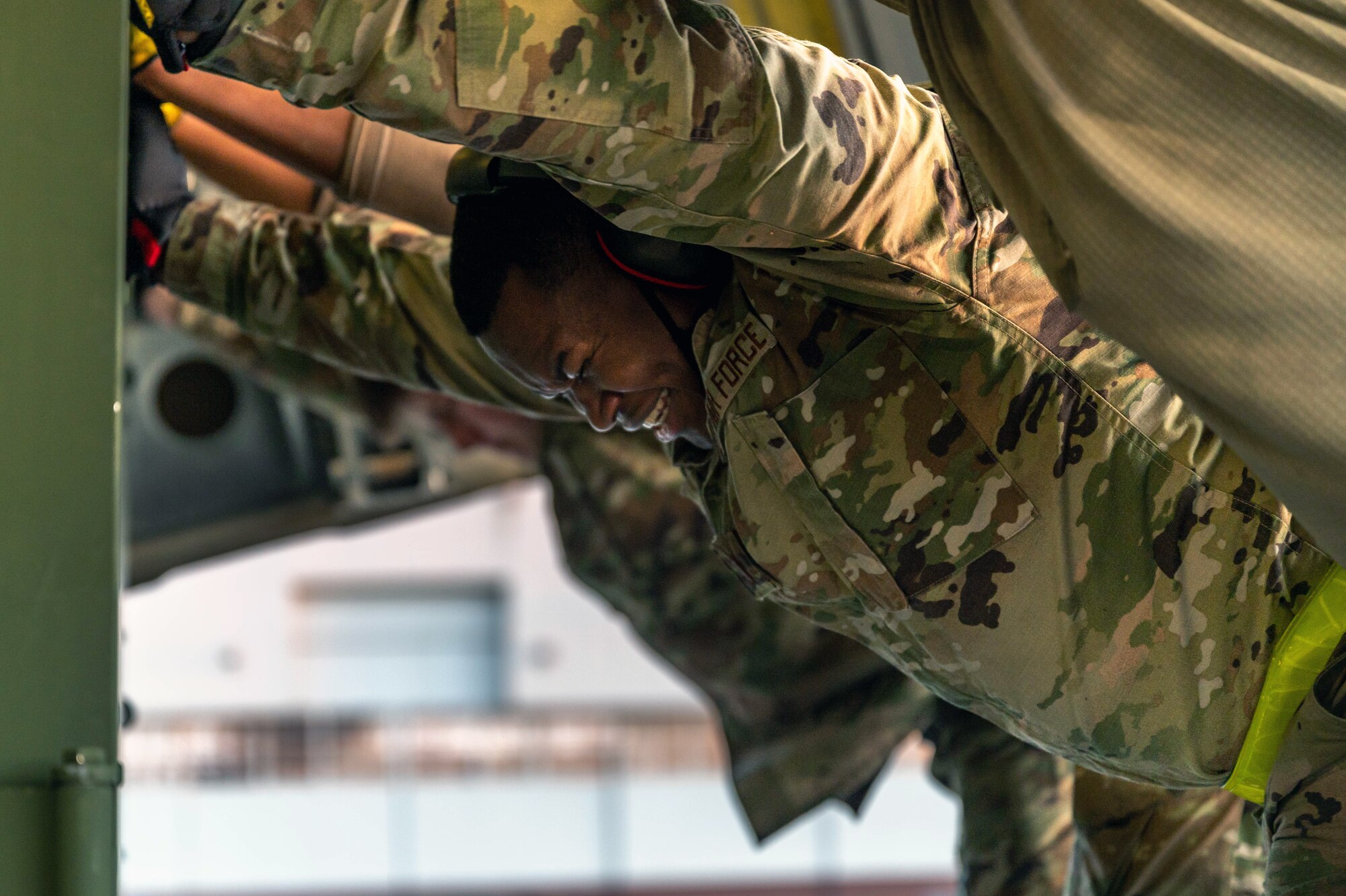 Second Lt. Marvin, 633rd Logistics Readiness Squadron cargo deployment function officer in charge, pushes against an ISU-90 cargo container