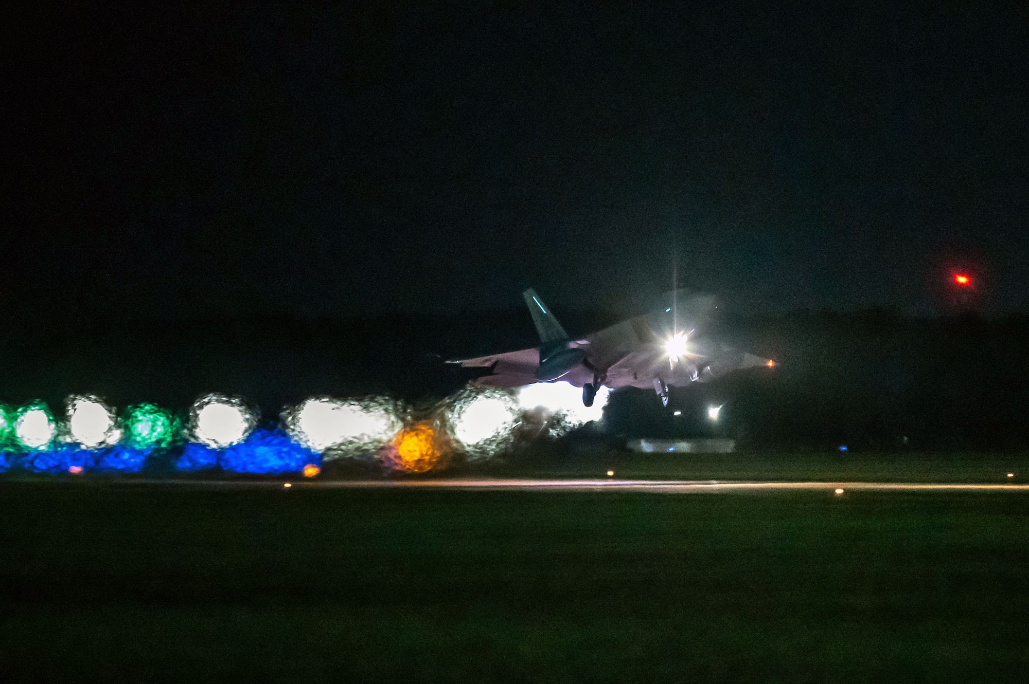 A U.S. Air Force F-22 Raptor, assigned to the 1st Fighter Wing, takes off from the flightline