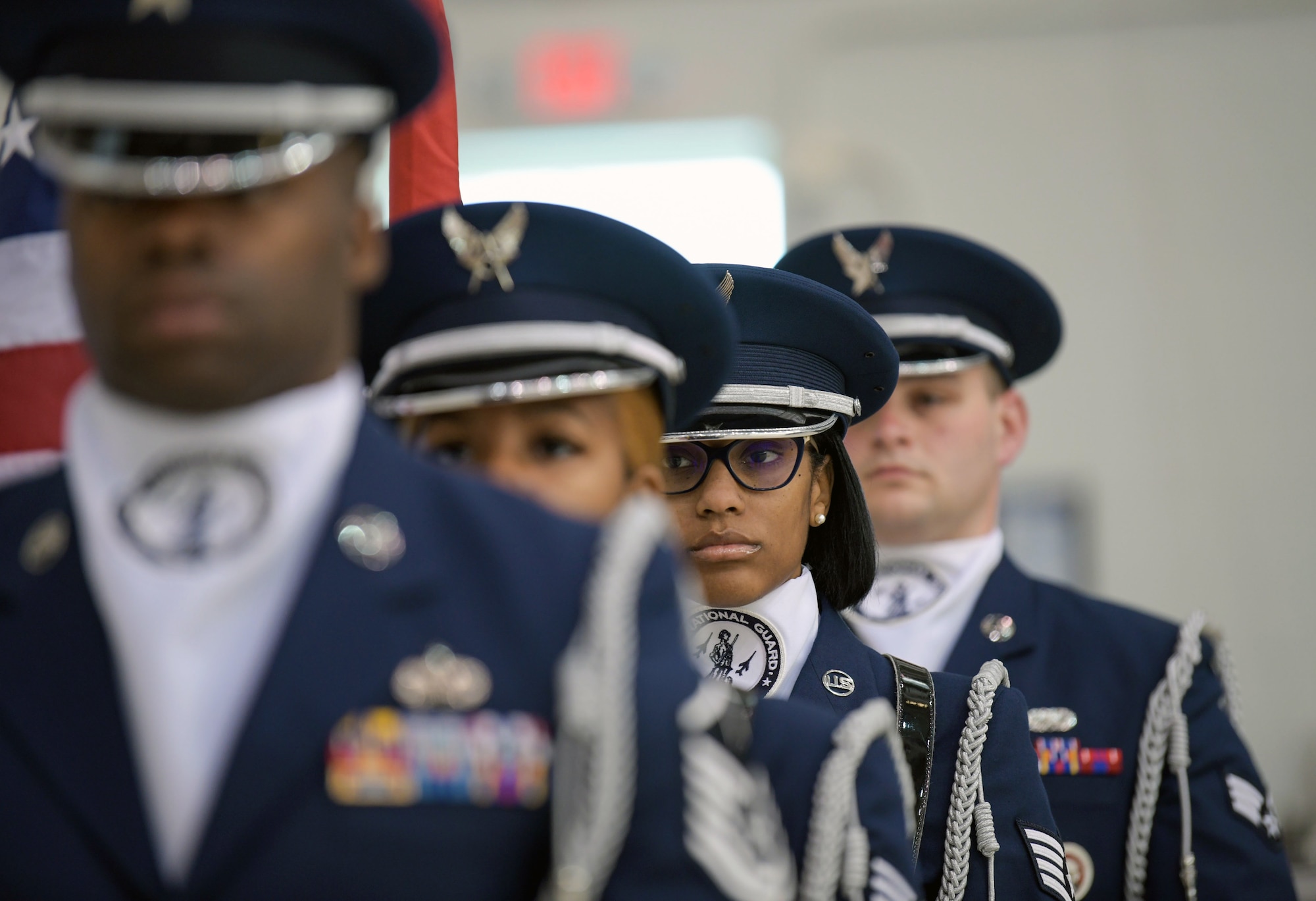 Airmen with the 172nd Airlift Wing Honor Guard stand ready to present the colors