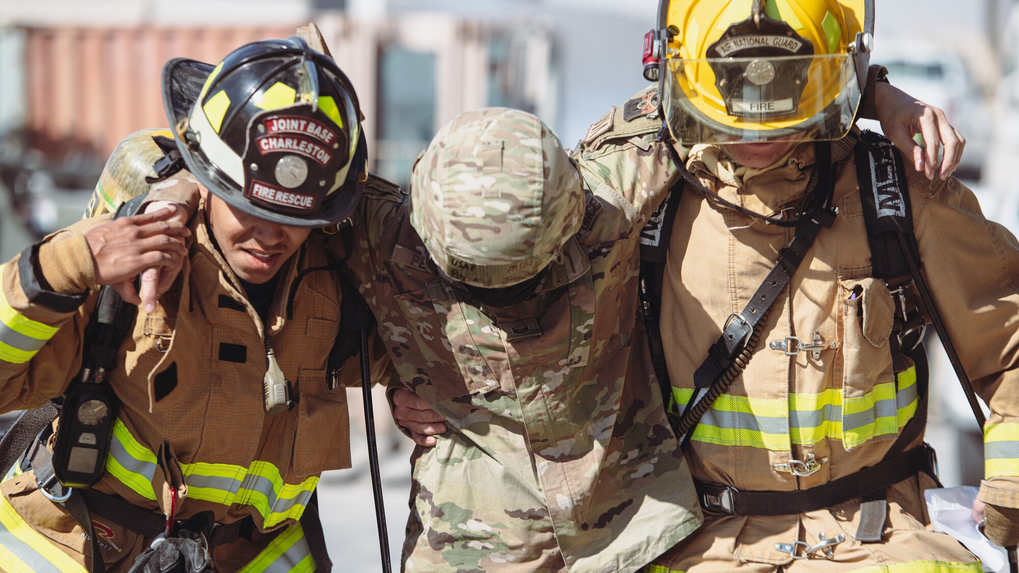 Firefighters help injured person.