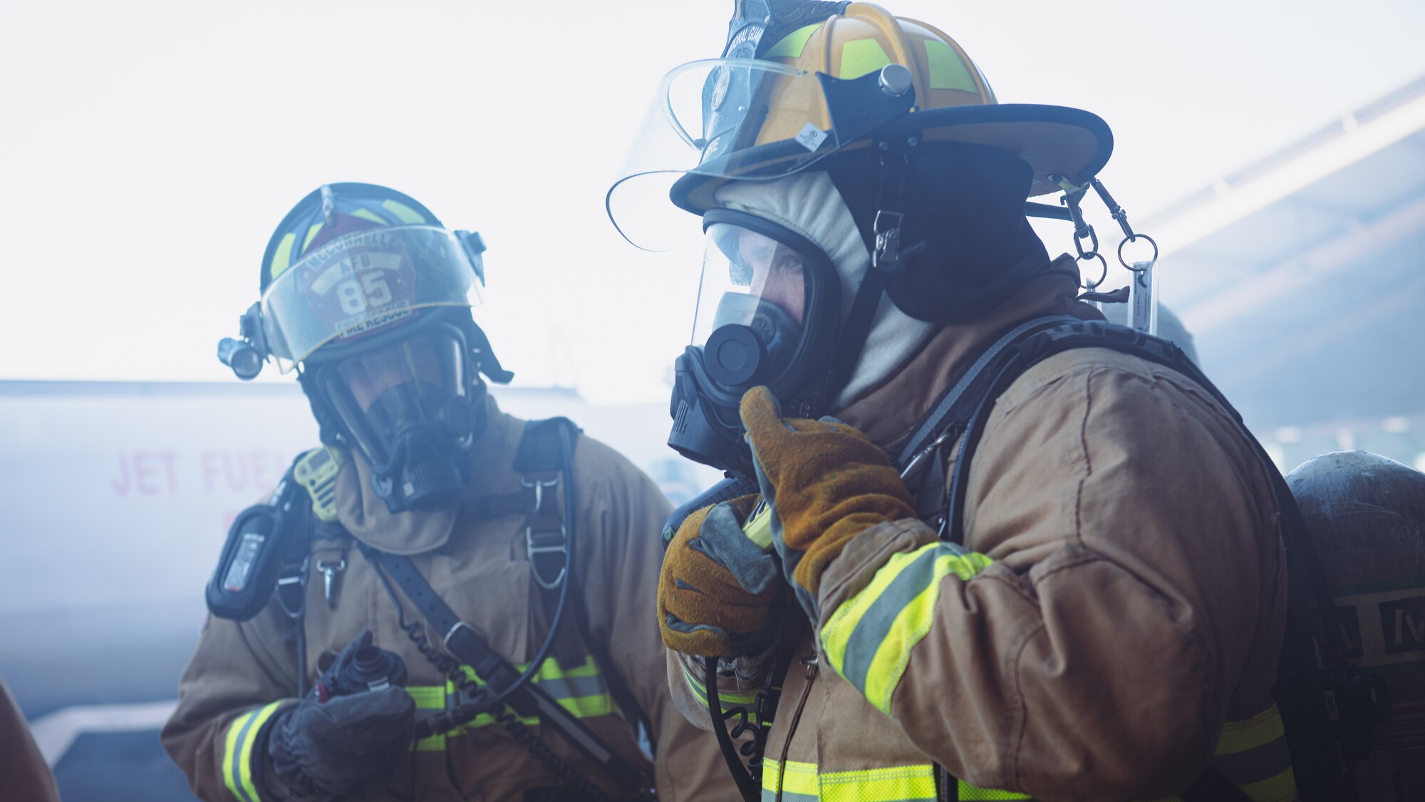 Firefighter talks on radio.