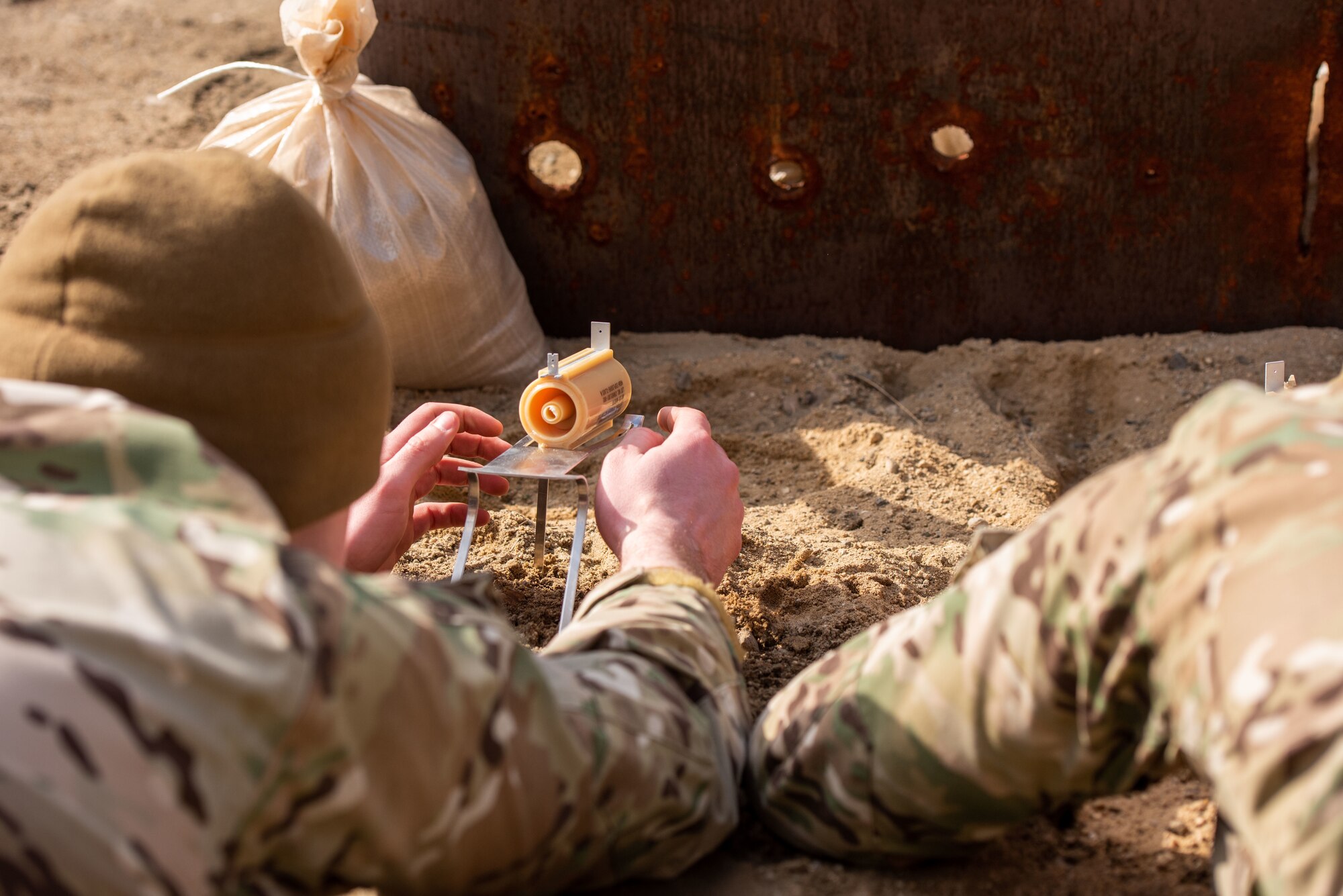 Airman 1st Class James Franklin, 51st Civil Engineer Squadron Explosive Ordnance Disposal (EOD) technician, sets up a shaped Composition 4 (C-4) explosive charge at a test site