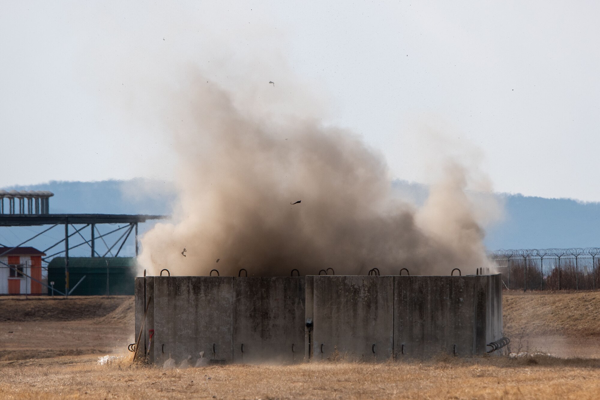 An explosive charge is detonated at a 51st Civil Engineer Squadron Explosive Ordnance Disposal (EOD) flight test site