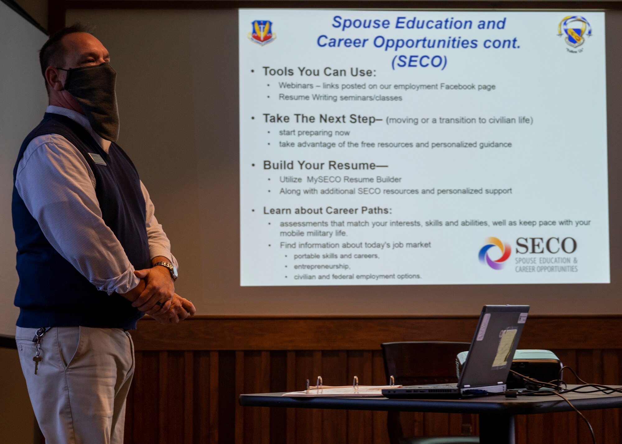 Attendees of the Spouse Education and Employment seminar receive an information folder at Seymour Johnson Air Force Base, North Carolina, Jan. 26, 2022.