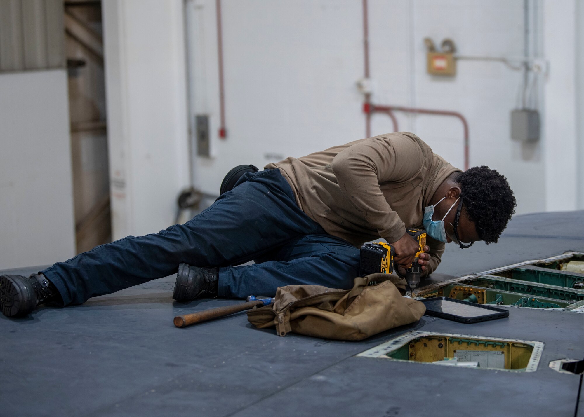Senior Airman Gary Smith, 4th Equipment Maintenance Squadron crew chief, replaces a nut plate on an F-15E Strike Eagle at Seymour Johnson Air Force Base, North Carolina, Jan. 7, 2022.