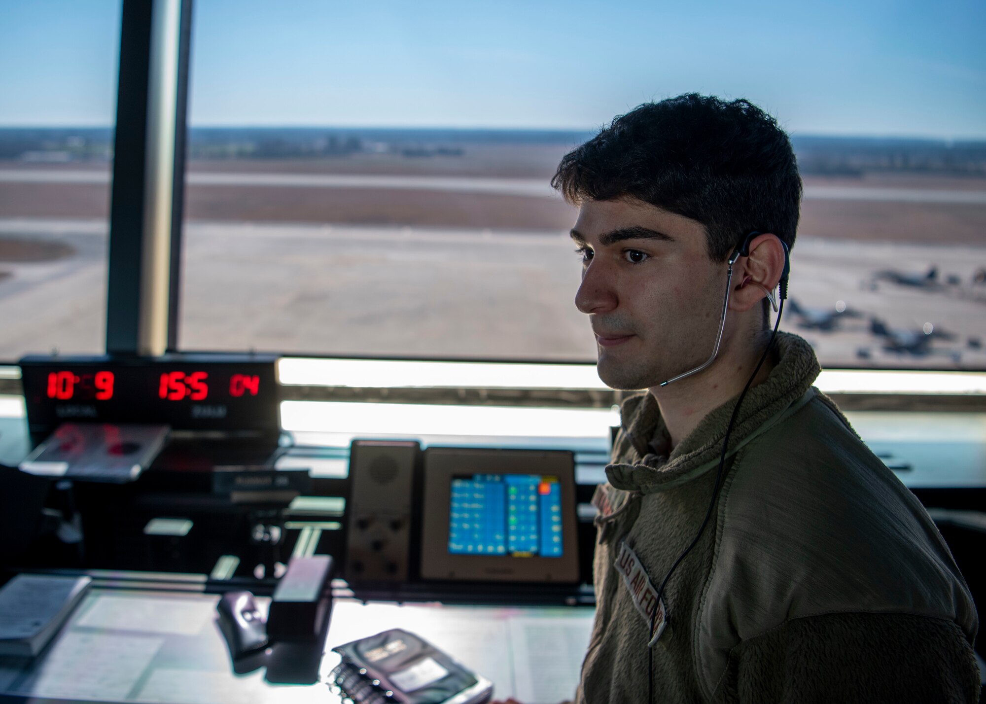 Senior Airman Daniel Tumminello, 4th Operations Support Squadron air traffic control technician, prepares to begin his duties at Seymour Johnson Air Force Base, North Carolina, Feb. 10, 2022.