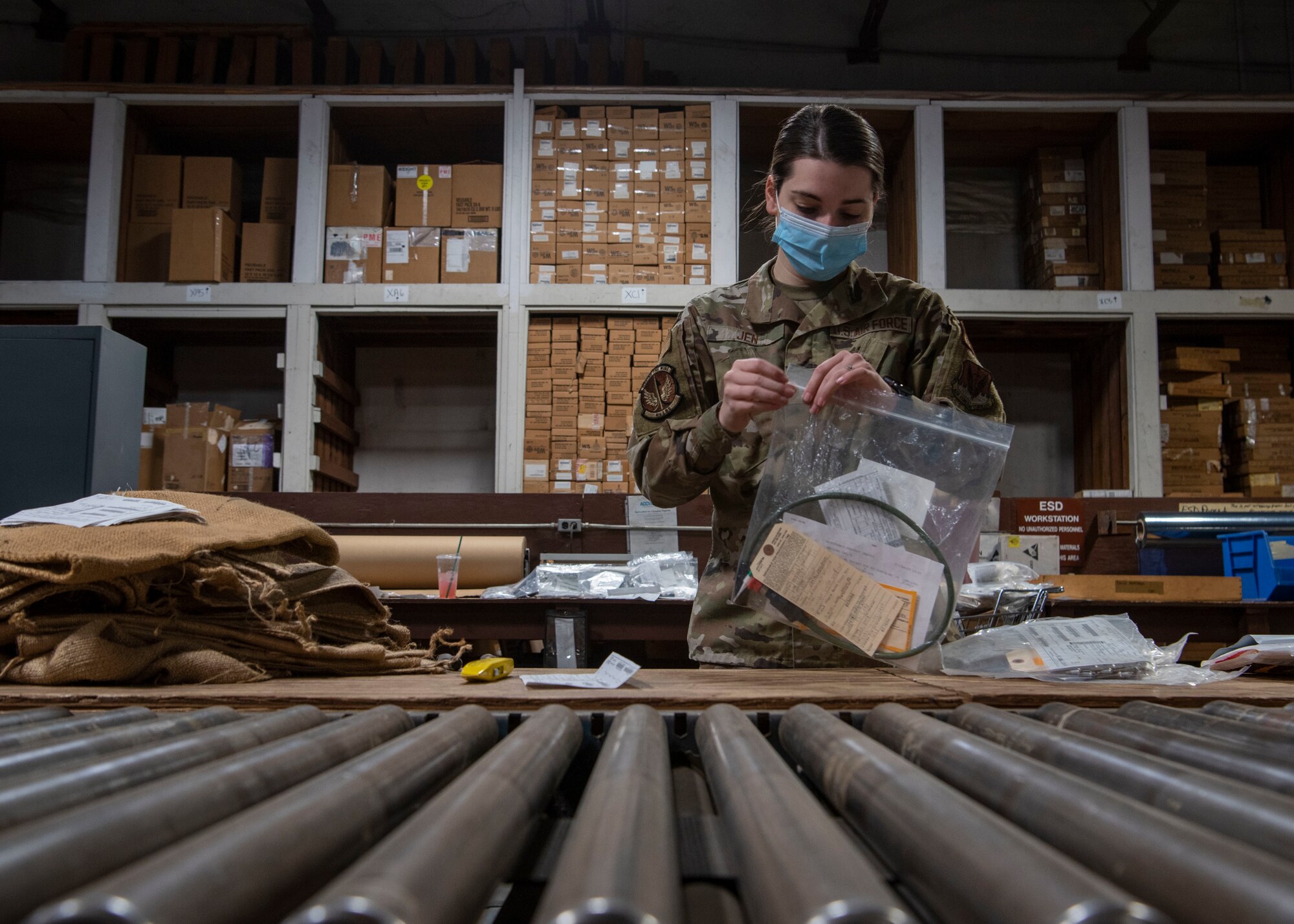 Airman 1st Class Meghan Jen, 4th Logistics Readiness Squadron outbound cargo technician, works to consolidate shipments at Seymour Johnson Air Force Base, North Carolina, Jan. 14th, 2022.
