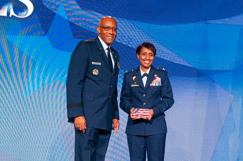 Air Force Chief of Staff Gen. CQ Brown, Jr. recognizes Col. Jenise M. Carroll, the 75th Air Base Wing commander at Hill Air Force Base, Utah, as one of two Air Force Military Service Award recipients named during the 2022 Black Engineer of the Year Science, Technology, Engineering and Mathematics conference in Washington, D.C., Feb. 18, 2022. Carroll was recognized for her tremendous accomplishments and mentorship in STEM career fields over the course of the past year. (U.S. Air Force photo by Staff Sgt. Nicolas Z. Erwin)
