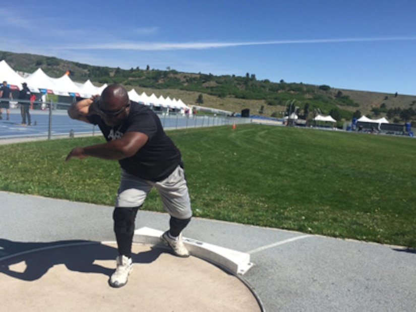 Retired Staff Sgt. Dorian Rhoten throws a shot put at the Air Force Academy in May 2018.