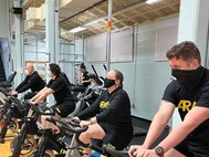 Soldiers work out at the Joint Base Lewis-McChord Soldier Recovery Unit (SRU) in Tacoma, Washington, where a new scoreboard is helping spur competition.