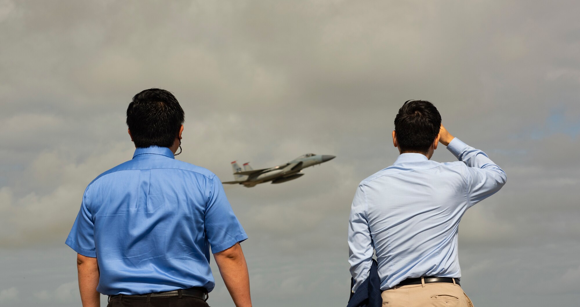 Spectators from the local community watch aircraft take off from Andersen Air Force Base, Guam, during a take-off viewing day for exercise Cope North 22, Feb. 15, 2022. Service members, their families, and local community members were invited to the flight line to learn the importance of Cope North while observing aircraft capabilities.  Exercise Cope North is the U.S. Pacific Air Forces’ largest multilateral exercise and includes more than 2,500 U.S. Airmen, Marines, and Sailors working alongside 1,000 combined Japan Air Self-Defense Force and Royal Australian Air Force counterparts. (U.S. Air Force Photo by Senior Airman Helena Owens