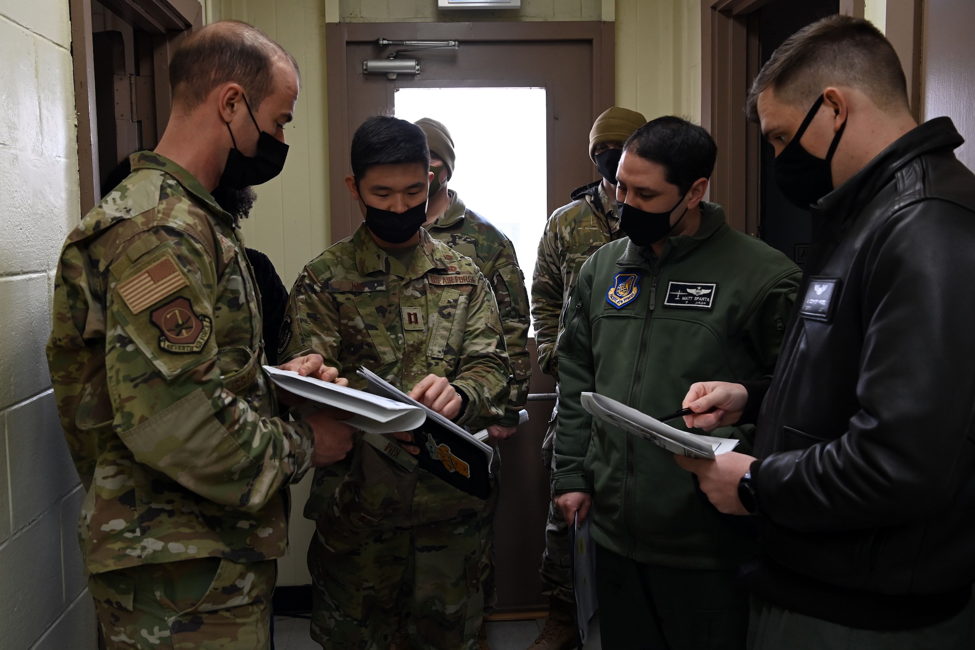 Capt. Min Kim, 607th Material Maintenance Squadron, Detachment 1, commander, speaks with Airmen during a site survey at Gwangju Air Base, Republic of Korea, February 15, 2022. Kim coordinates consistently with outside units to ensure the War Reserve Material (WRM) facilities meet their requirements, should the need arise. (U.S. Air Force photo by Master Sgt. Rachelle Morris)