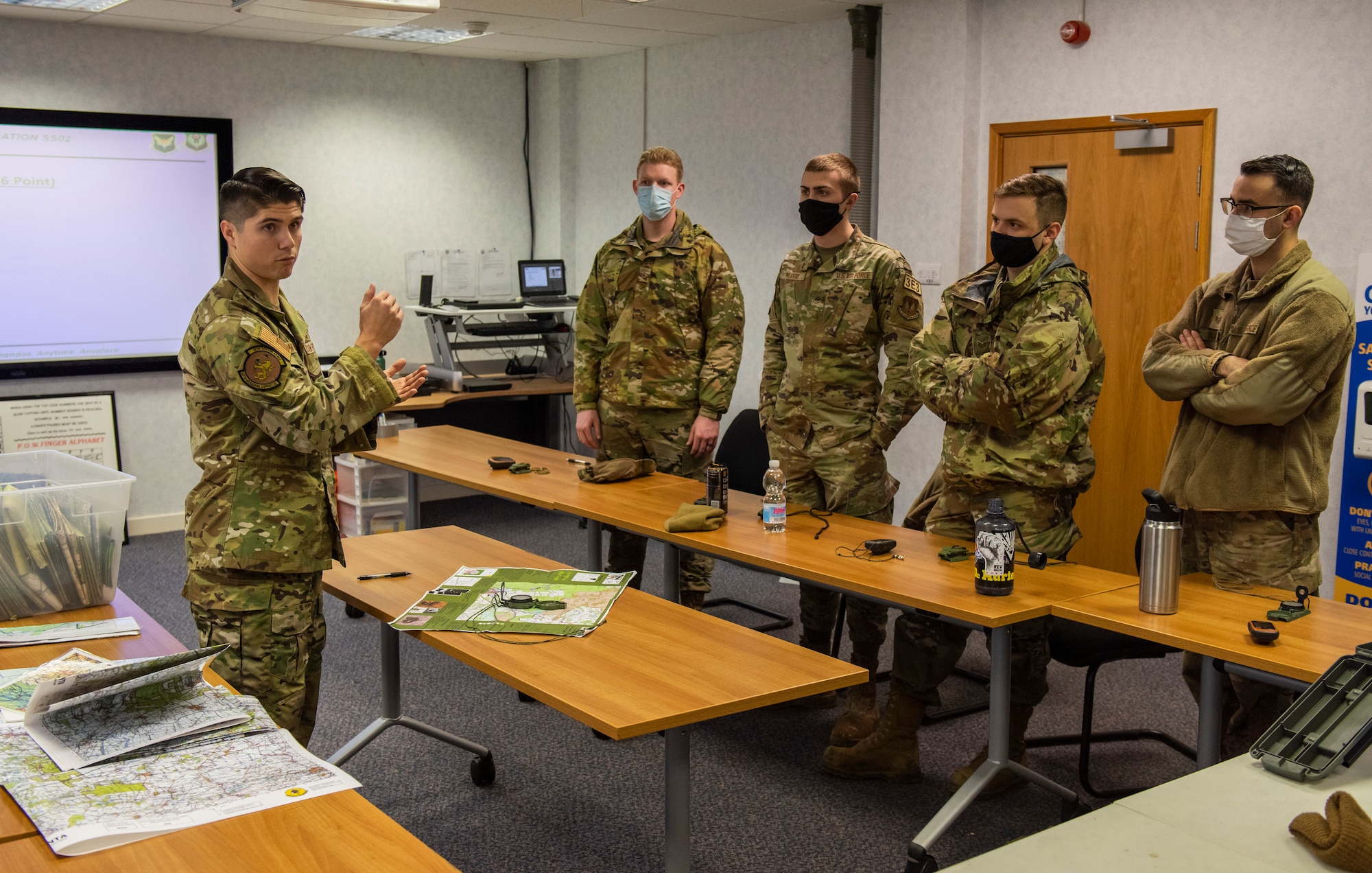 U.S. Air Force Tech. Sgt. Mark Mitchell, 100th Operations Support Squadron Survival, Evasion, Resistance, and Escape NCO in charge of training, leads land navigation training for members of the 100th Civil Engineer Squadron on Royal Air Force Mildenhall, England, Feb. 17, 2022. Members of the 100th CES learned how to read a map, plot a course, and navigate through virtually any environment with or without the use of a GPS device. (U.S. Air Force photo by Senior Airman Kevin Long)