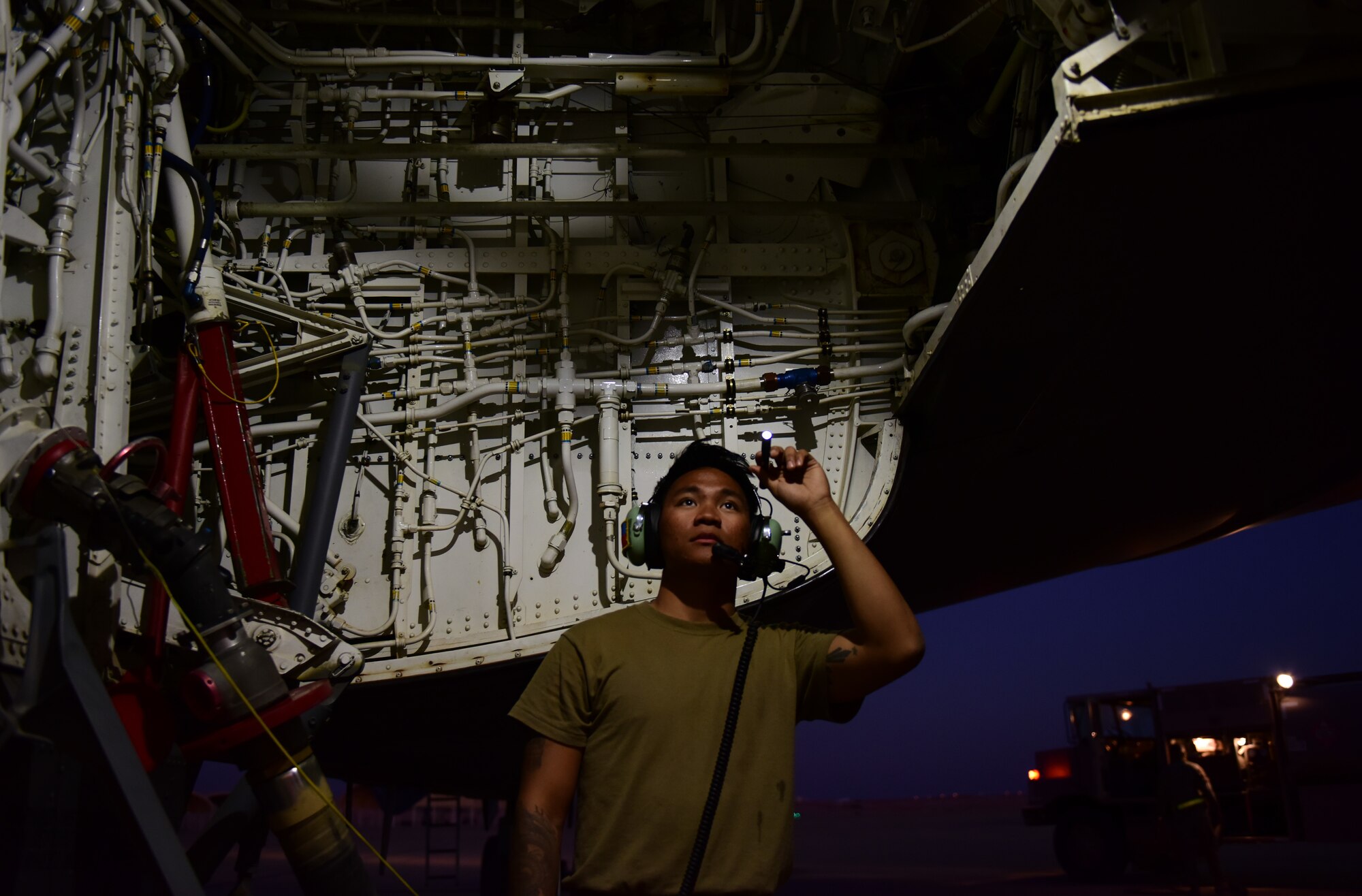 Photo of a U.S. Air Force Airman inspecting a KC-135 Stratotanker