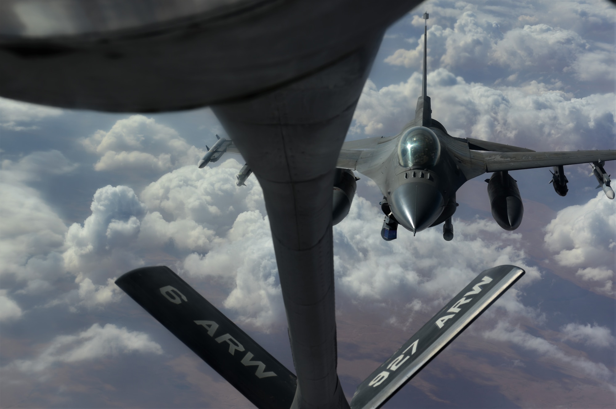 Photo of a U.S. Air Force F-16 Fighting Falcon aircraft flying over Southwest Asia