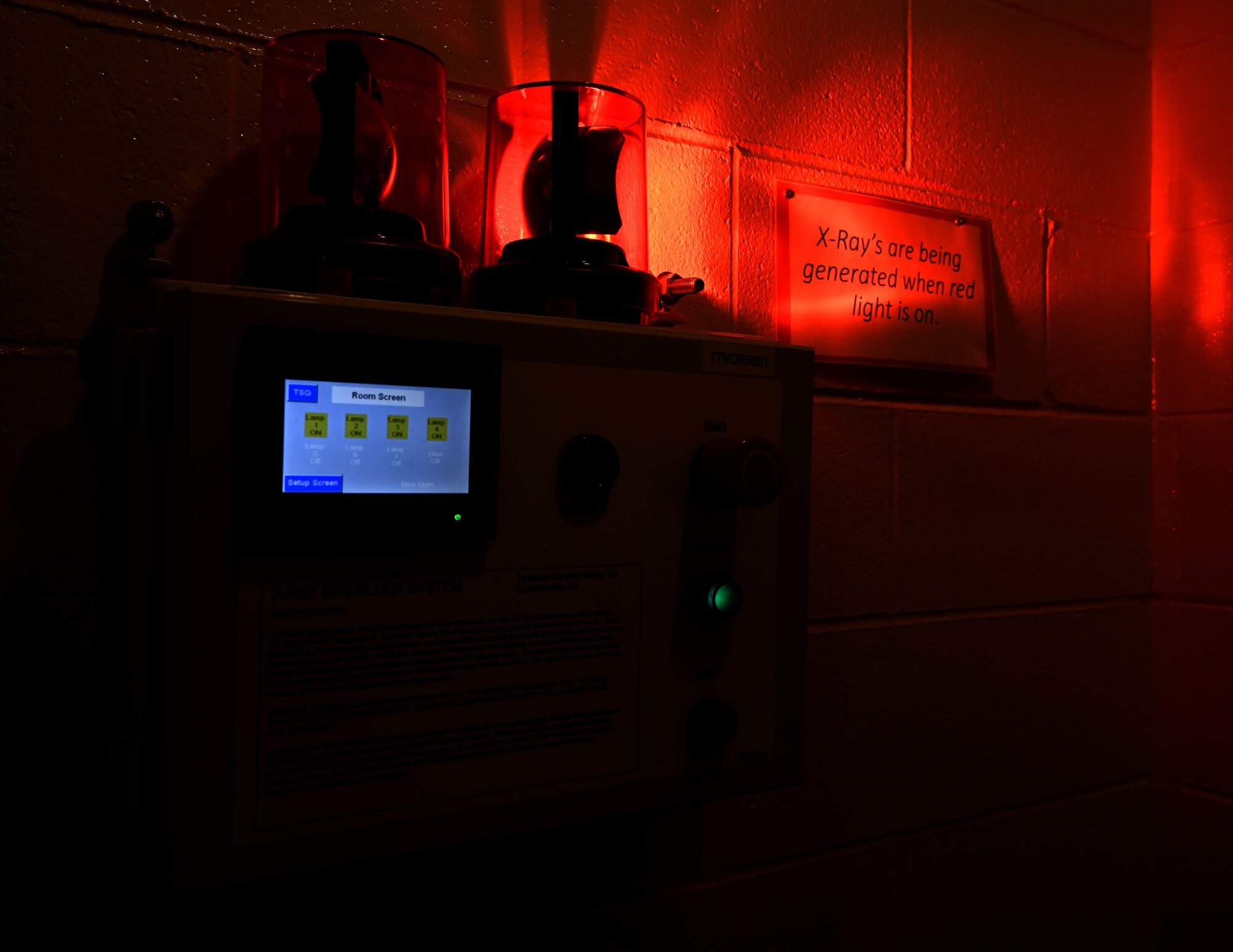 A red light oscillates while a siren pierces the ears of individuals in the surrounding area to ensure no one is too close when the x-ray imaging system is in use