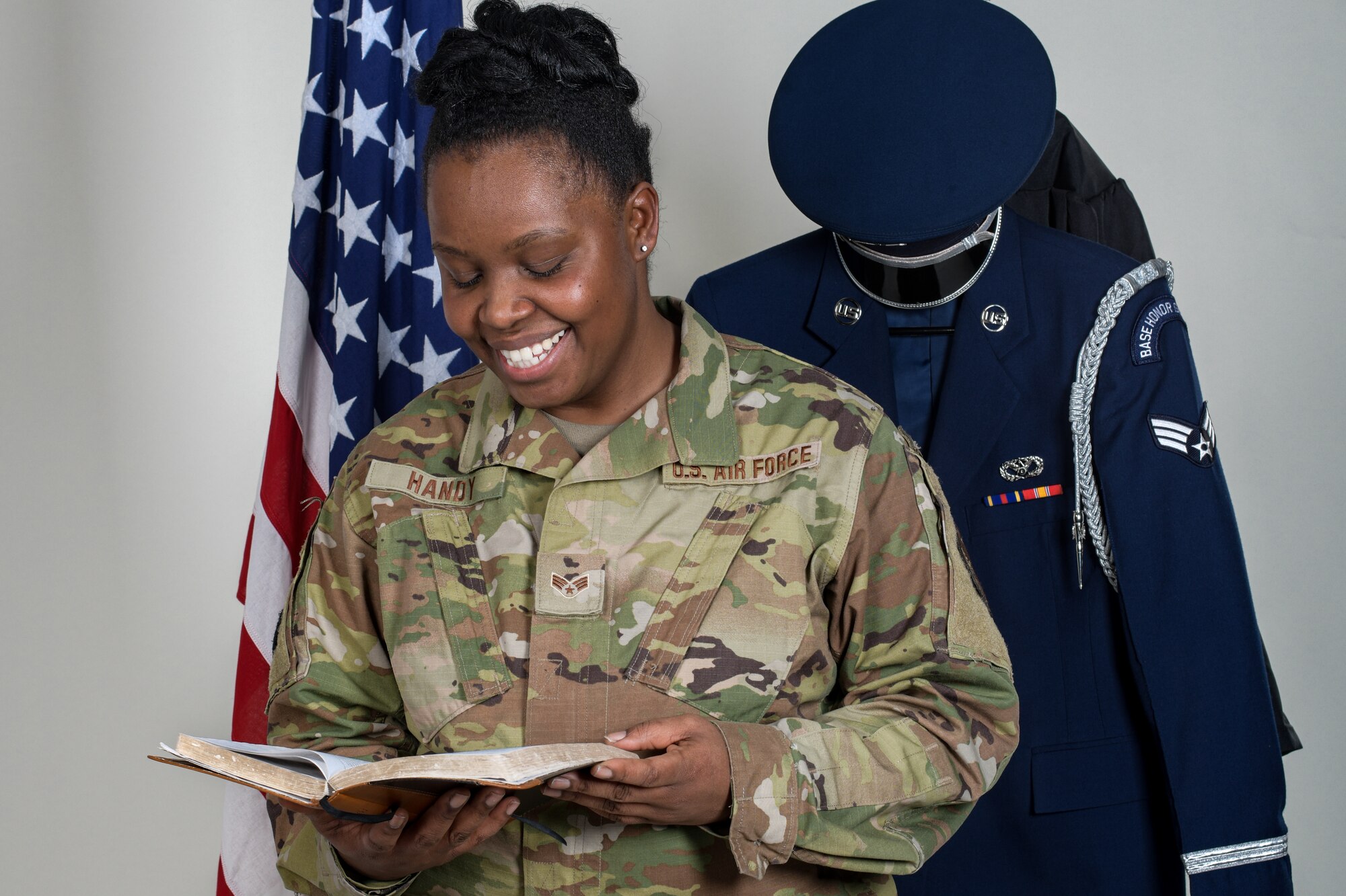 Senior Airman Jasmine Handy, an operations management helper with the 910th Civil Engineer Squadron, holds a bible on Jan. 9, 2022, at Youngstown Air Reserve Station.