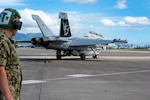 A U.S. Navy EA-18G Growler aircraft assigned to Electronic Attack Squadron 209, Naval Air Station Whidbey Island, Wash., prepares for flight during a joint exercise Jan. 25, 2022, Joint Pearl Harbor-Hickam, Hawaii. The exercise provides participants with a multi-faceted, collaborative venue with supporting infrastructure and personnel. (U.S. Air National Guard photo by Master Sgt. Mysti Bicoy)