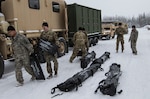 Alaska National Guard Soldiers with 1st Battalion, 297th Forward Support Company and Colorado National Guard Soldiers with 5th Battalion, 19th Special Forces Group load equipment and supplies into their Light Medium Tactical Vehicles before departing for Fort Greely, Alaska, as part of exercise Arctic Eagle 2018, Feb. 22, 2018. Arctic Eagle is a special focus exercise managed by the Alaska National Guard to test and validate Arctic capabilities for participating units. (U.S. Army photo by Sgt. Seth LaCount)