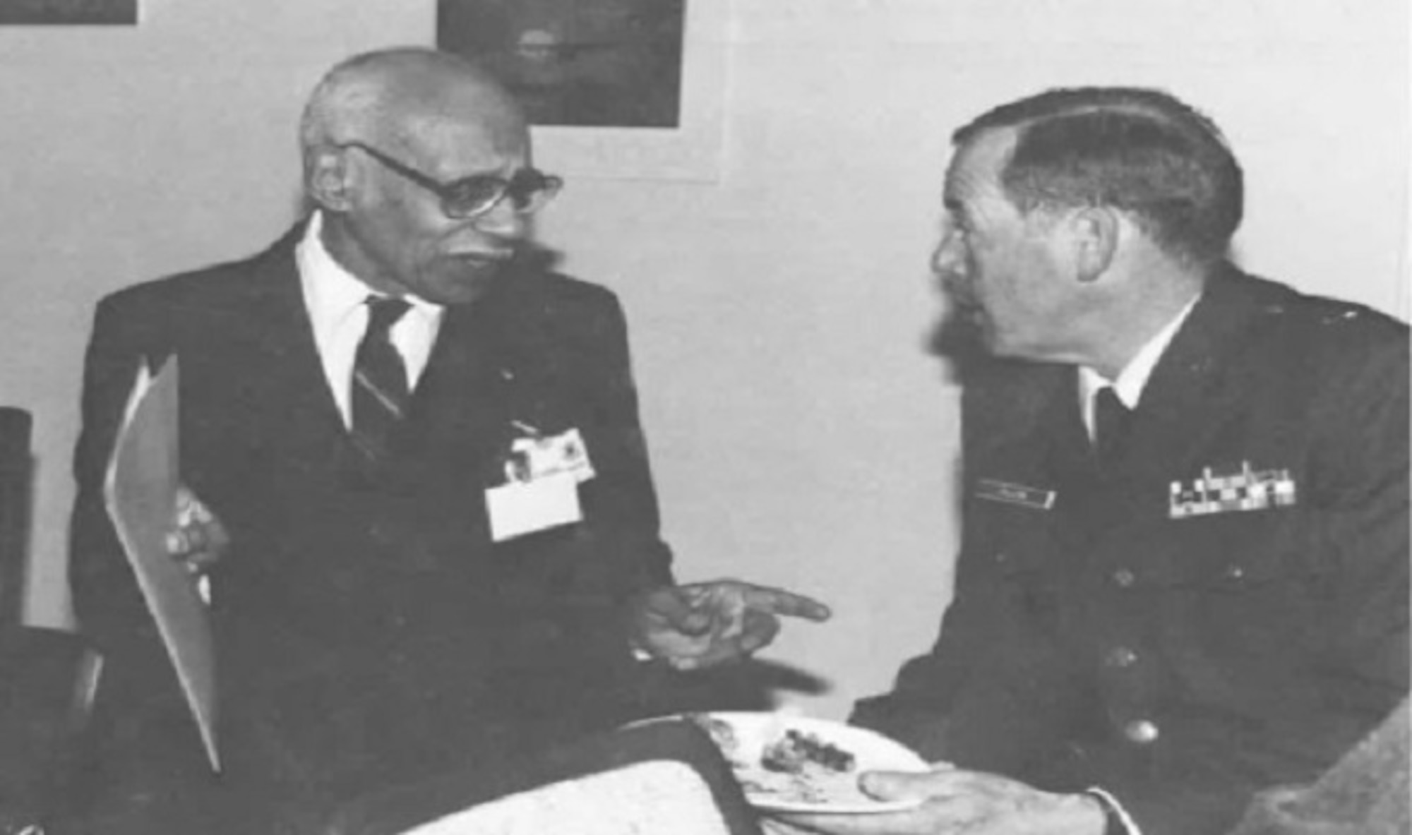 Retired Special Agent George C. Mosee (left) meets with then Office of Special Investigations Commander, Brig. Gen. Francis R. Dillon, during a Feb. 14, 1991, Black Heritage Month event at OSI headquarters. Mosee was one of the first five African Americans to serve in OSI. (U.S. Air Force photo)