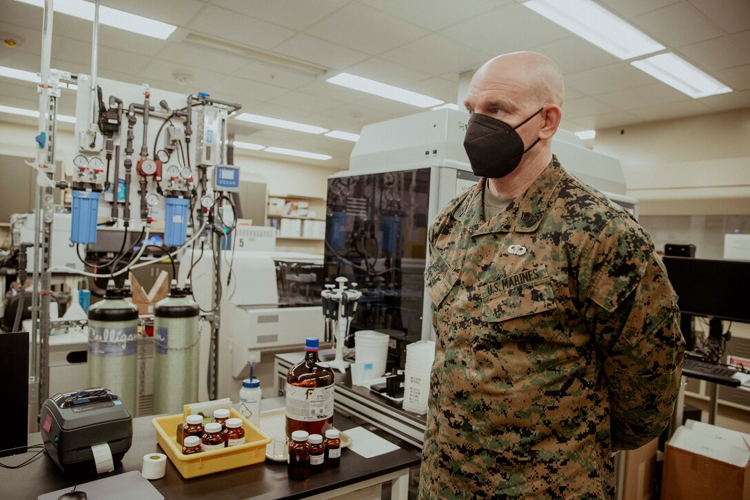 U.S. Marine Corps Sgt. Maj. Troy E. Black, the 19th Sergeant Major of the Marine Corps, receives a toxicology lab capabilities brief at Air Force Mortuary Affairs Operations, Dover Air Force Base, Dover, Delaware, Feb. 8, 2022. The Sergeant Major of the Marine Corps conducted the visit to thank the service members responsible for receiving and caring for fallen service members. The Armed Forces Medical Examiner System provides the Department of Defense and other federal agencies comprehensive forensic investigative services, to include forensic pathology, DNA Forensics, forensic toxicology, and medical mortality surveillance. (U.S. Marine Corps photo by Staff Sgt. Victoria Ross)