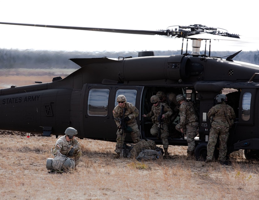 Soldiers exit UH-60 Blackhawk helicopter