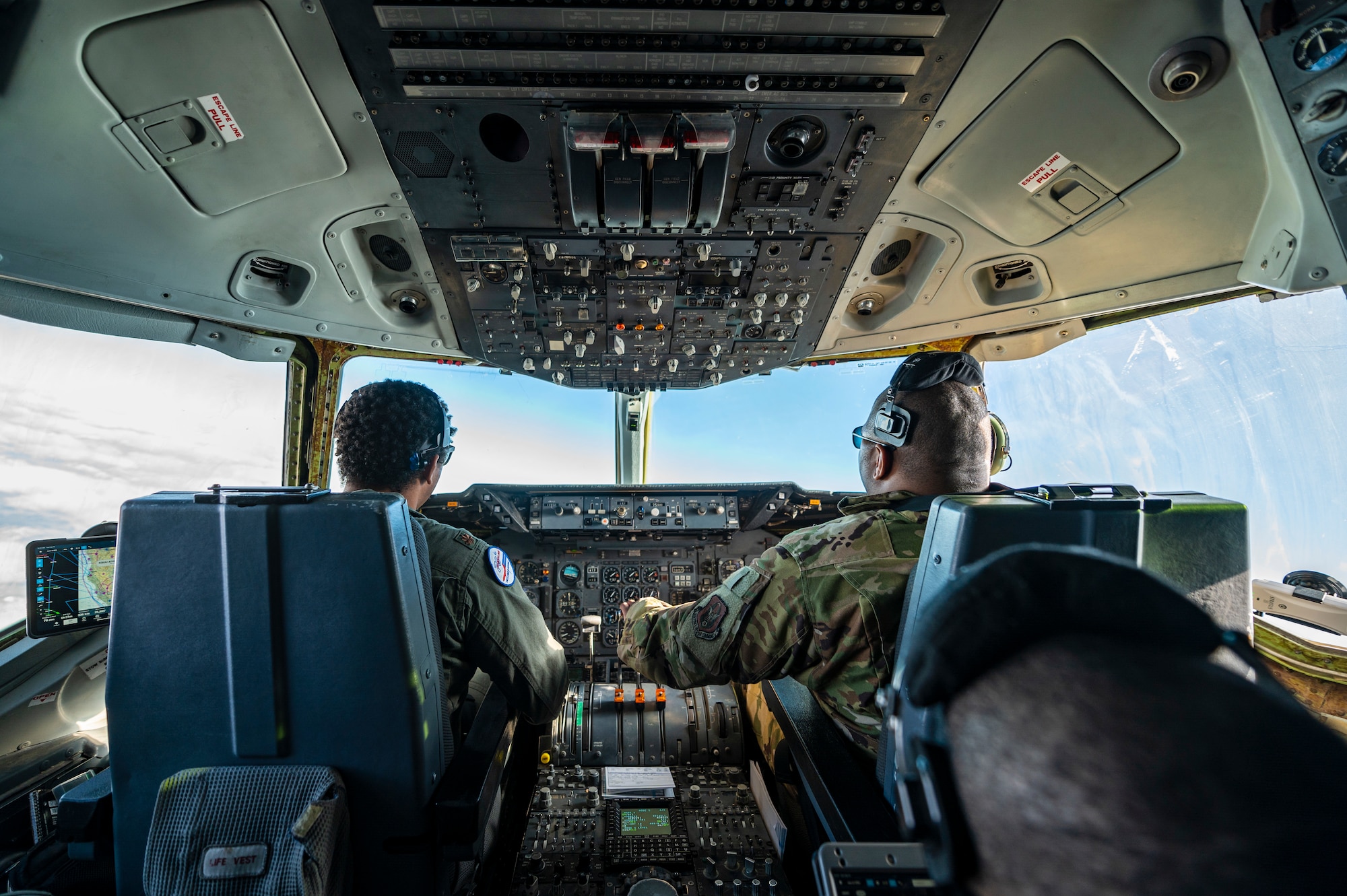 Pilots fly a plane