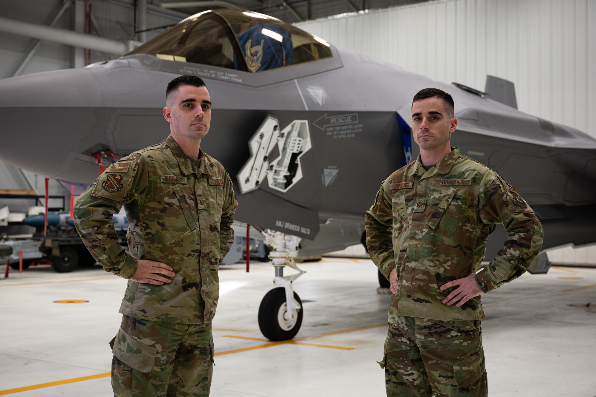 U.S. Air Force Staff Sgt. Jacob Bussard, a 354th Maintenance Group (MXG) quality assurance evaluator (left), and Staff Sgt. Joshua Bussard, a 354th MXG weapons standardization squadron lead crew team chief, pose for a photo on Eielson Air Force Base, Alaska, Feb. 1, 2022.