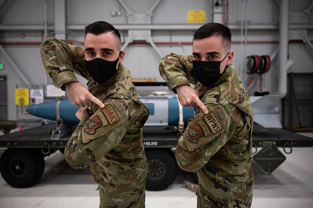 U.S. Air Force Staff Sgt. Jacob Bussard, a 354th Maintenance Group (MXG) quality assurance evaluator (left), and Staff Sgt. Joshua Bussard, a 354th MXG weapons standardization squadron lead crew team chief, pose for a photo on Eielson Air Force Base, Alaska, Feb. 1, 2022.
