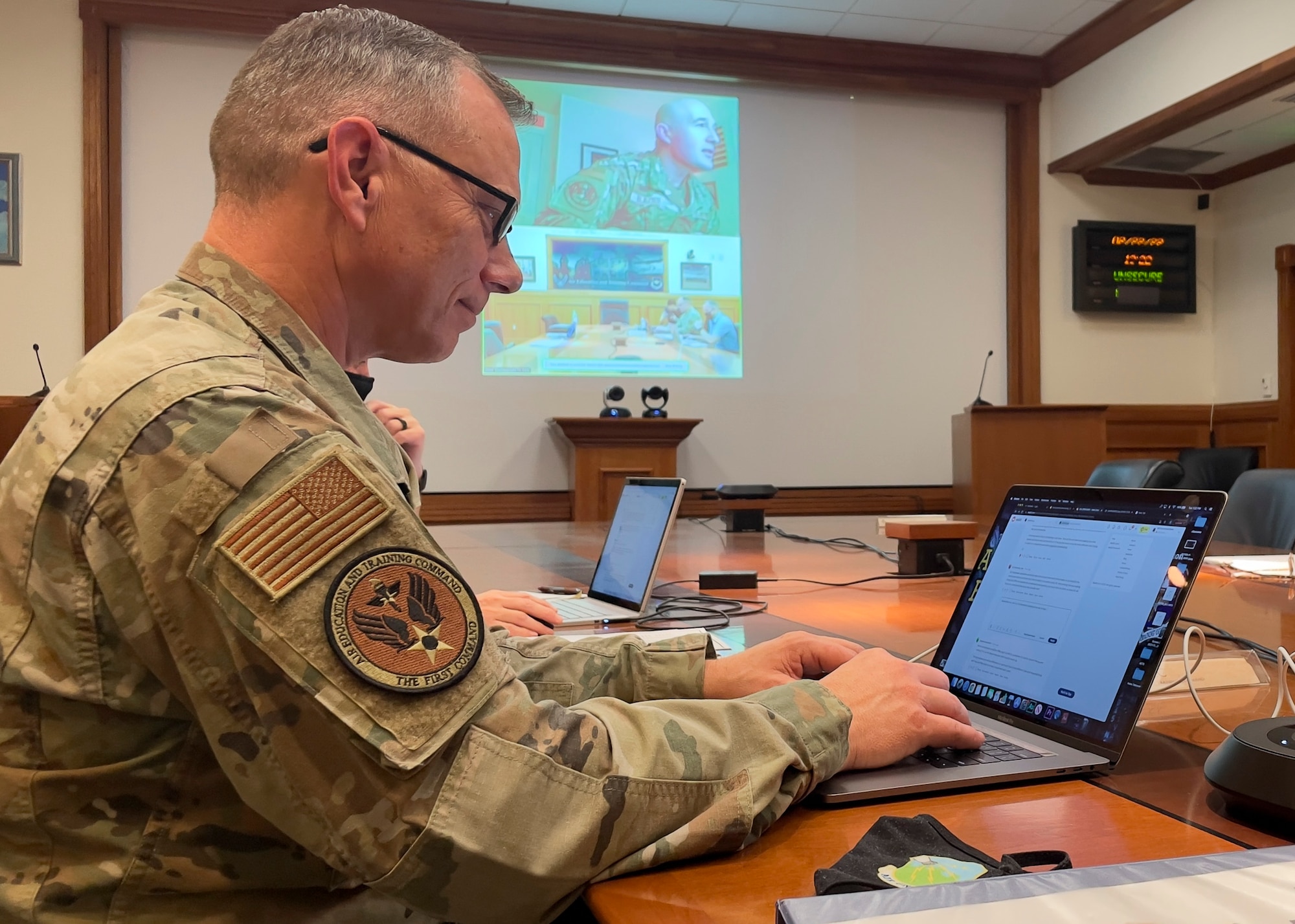 Command Chief of Air Education and Training Command U.S. Air Force Chief Master Sgt. Erik Thompson types on a laptop