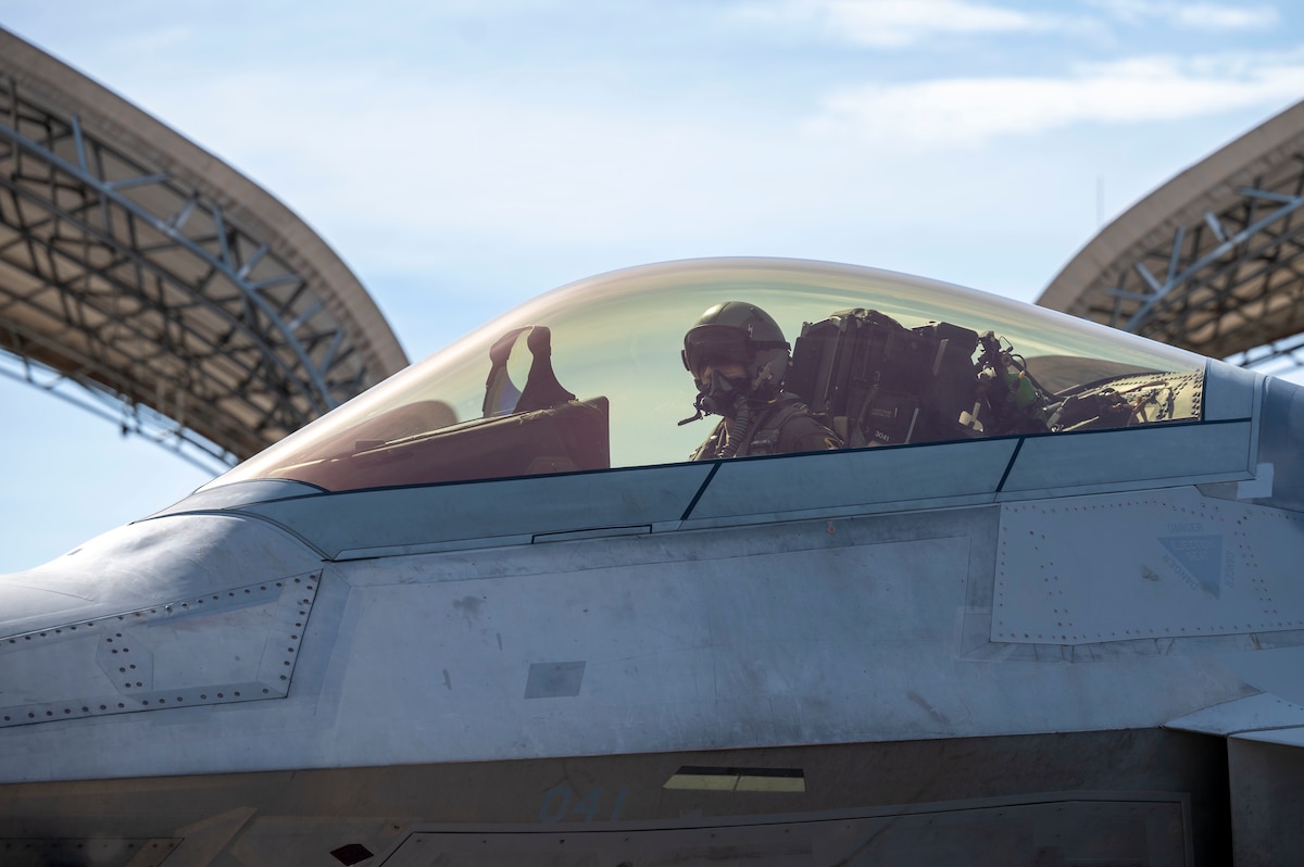 An f-22 Raptor taxiing on a runway