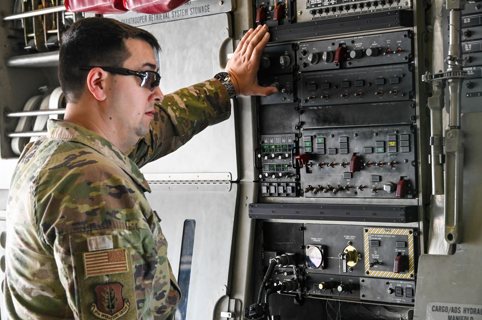 U.S. Air Force Tech. Sgt. Nathan Duncan, 58th Airlift Squadron instructor loadmaster, operates a control panel in a C-17 Globemaster III at Laughlin Air Force Base, Texas, Feb. 1, 2022. The COPE THAW mission included more than 50 maintenance personnel, T-38 Talon instructor pilots and student pilots. (U.S. Air Force photo by Senior Airman Kayla Christenson)