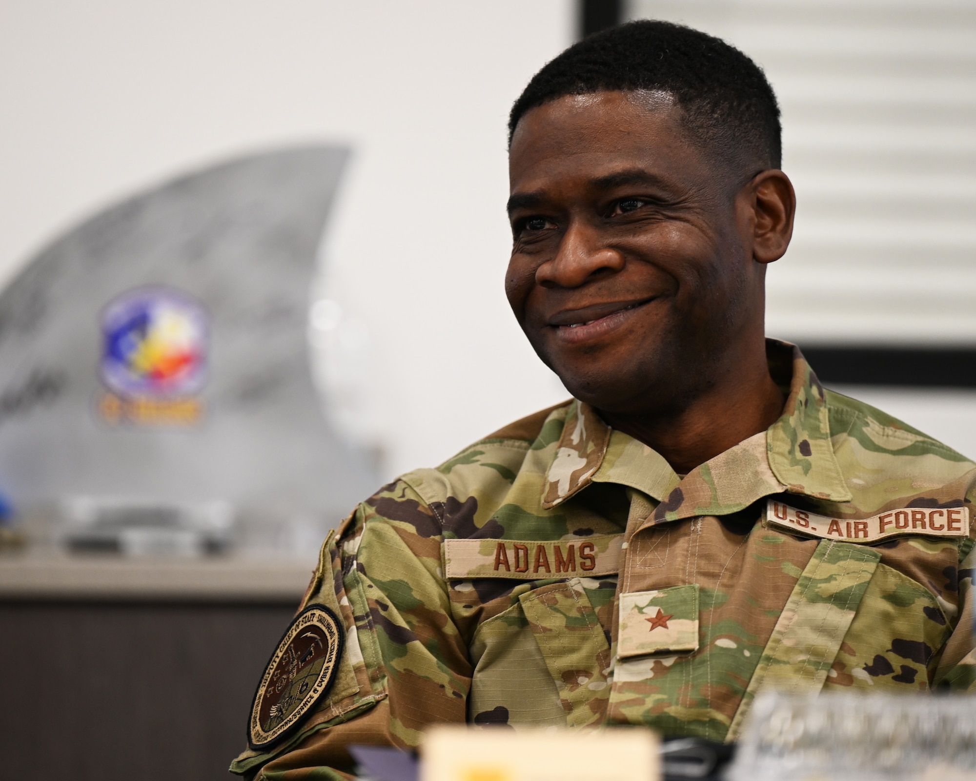 U.S. Air Force Brig. Gen. Terrence A. Adams, Military Deputy Director of Concepts and Strategy Air Force Futures, Headquarters U.S. Air Force, smiles during the Diversity and Inclusion Brown Bag at the Cressman Dining Facility, Goodfellow Air Force Base, Texas, Feb. 11, 2022. Adams led the panel discussion regarding diversity and inclusion, opening the floor for attendees to discuss important topics with senior leaders. (U.S. Air Force photo by Senior Airman Michael Bowman)