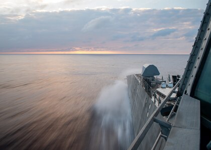 SOUTH CHINA SEA (Jan. 22, 2022) Independence-variant littoral combat ship USS Charleston (LCS 18) transits the South China Sea at full power during routine operations. Charleston, part of Destroyer Squadron (DESRON) 7, is on a rotational deployment in the U.S. 7th Fleet area of operation to enhance interoperability with partners and serve as a ready-response force in support of a free and open Indo-Pacific region. (U.S. Navy photo by Mass Communication Specialist 2nd Class Ryan M. Breeden)