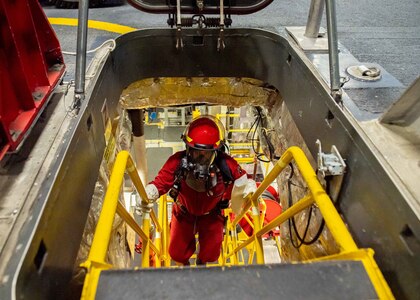 SOUTH CHINA SEA (Feb. 3, 2022) Engineman 1st Class Ryan Schneider, from Spencerville, Ohio, traverses an engineering space during a main space fire drill aboard Independence-variant littoral combat ship USS Charleston (LCS 18). Charleston, part of Destroyer Squadron (DESRON) 7, is on a rotational deployment in the U.S. 7th Fleet area of operation to enhance interoperability with partners and serve as a ready-response force in support of a free and open Indo-Pacific region. (U.S. Navy photo by Mass Communication Specialist 2nd Class Ryan M. Breeden)