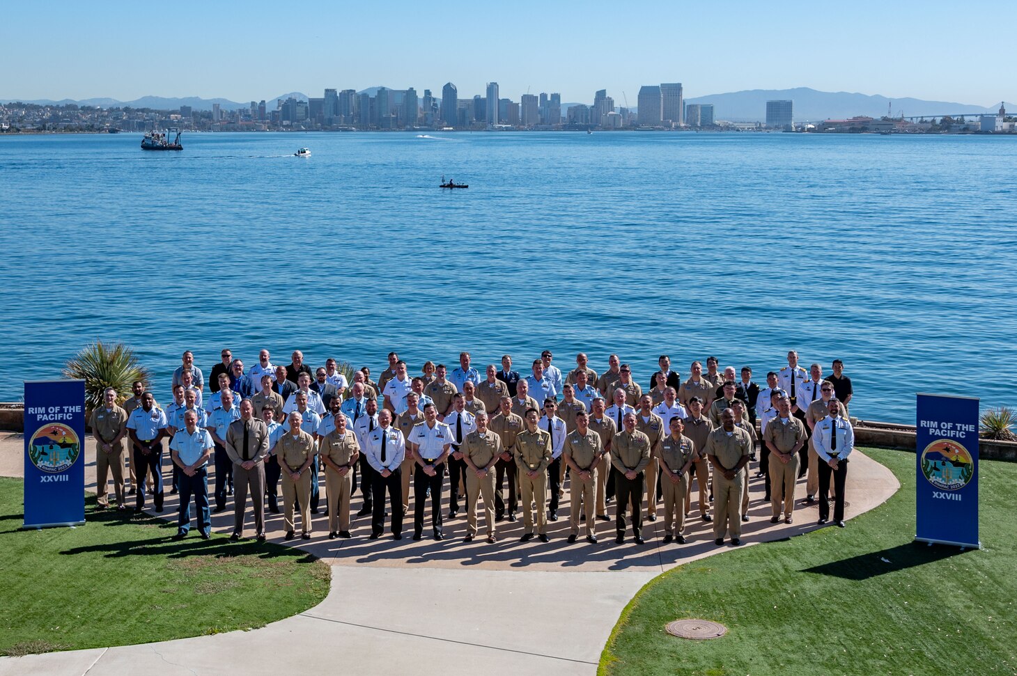 Exercise Rim of the Pacific (RIMPAC) 2022 senior leadership and staffs pose for a group photo onboard Naval Base Point Loma, Feb. 18.