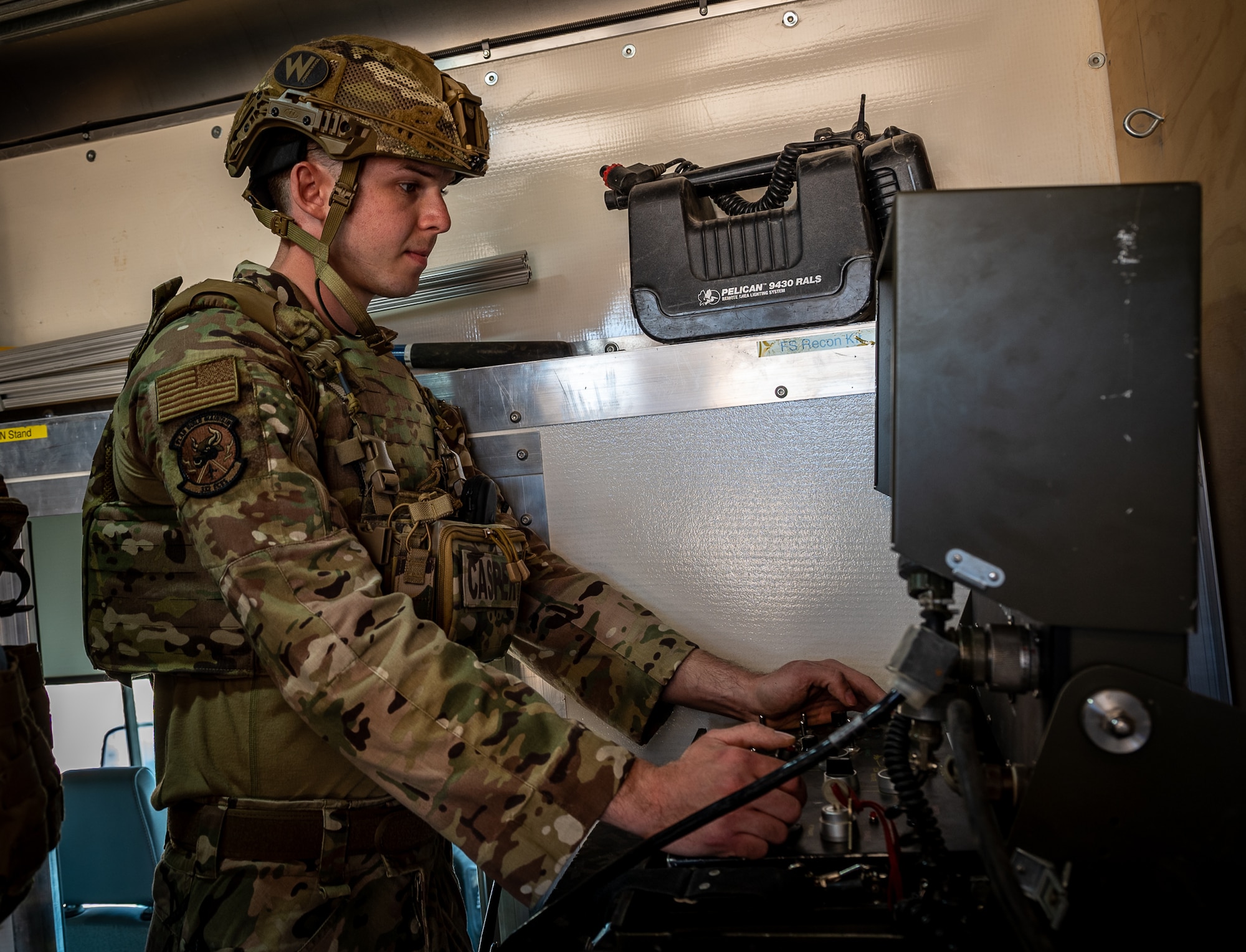 Senior Airman Andrew Payne, 332d Expeditionary Explosive Ordnance Disposal team member, remotely controls an EOD robot carrying a downed small unmanned aircraft system to a safe distance for possible detonation if determined to be hazardous during a counter SUAS training exercise in Southwest Asia Feb. 12, 2022. (U.S. Air Force photo by Master Sgt. Christopher Parr)