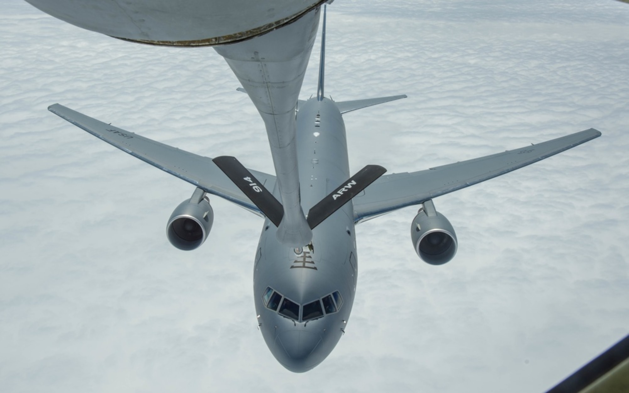 KC-135 boom is extended while a 157th ARW KC-46 gets closer for refueling over the Atlantic Ocean