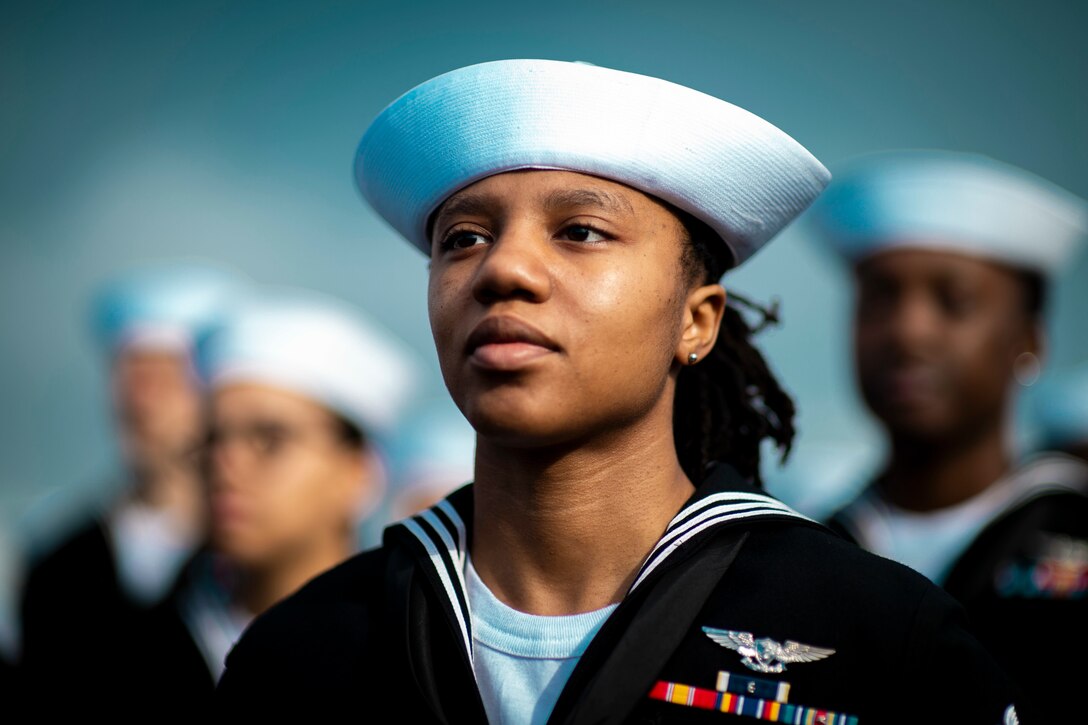 A sailor stands at attention.