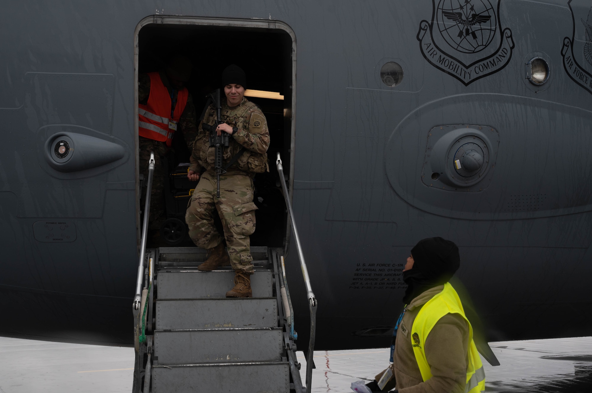An Army soldier departs a C-17 Globemaster III.