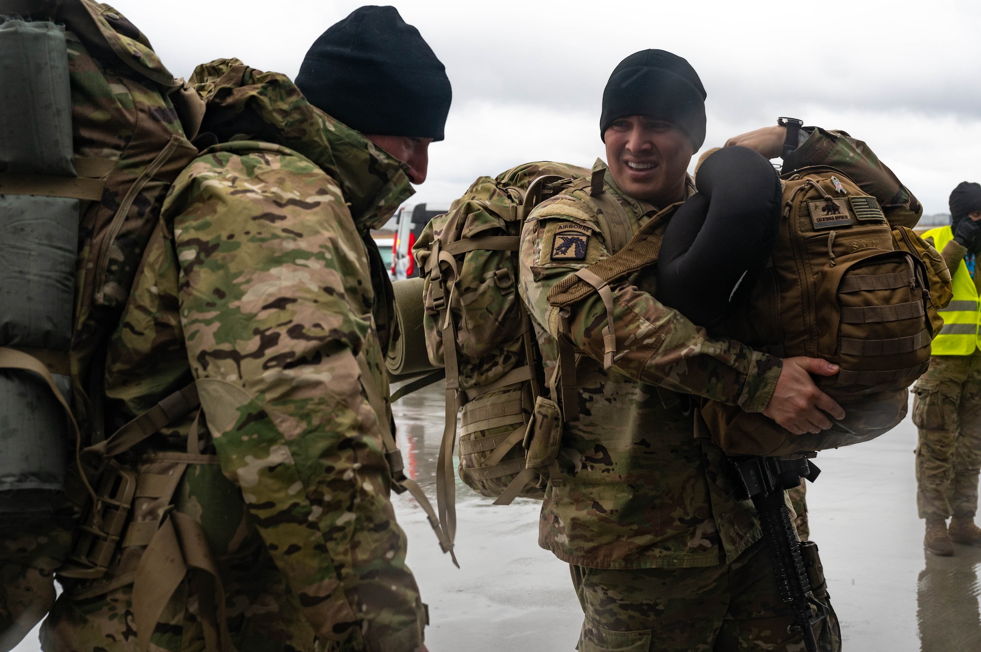 Army soldiers speak with each other.