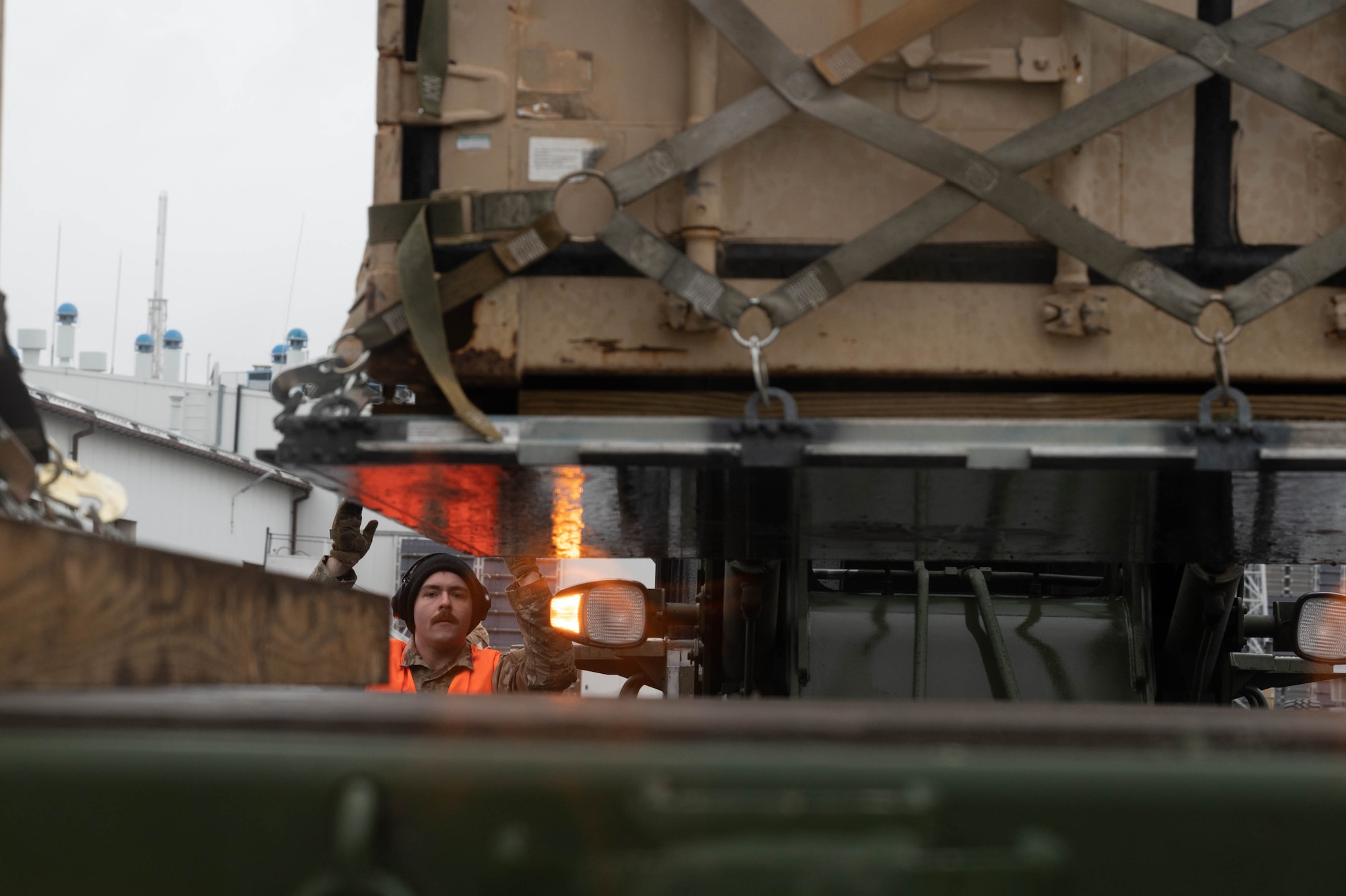 An Airman spots a 10K all-terrain forklift.