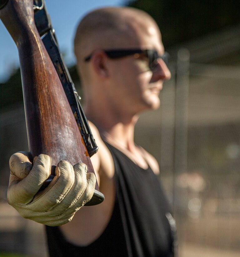 Lance Cpl. Winter Mathison, rifleman, Silent Drill Platoon, executes “pop and hold” during rehearsal at Marine Corps Air Station Yuma, Ariz., Feb. 15, 2022.