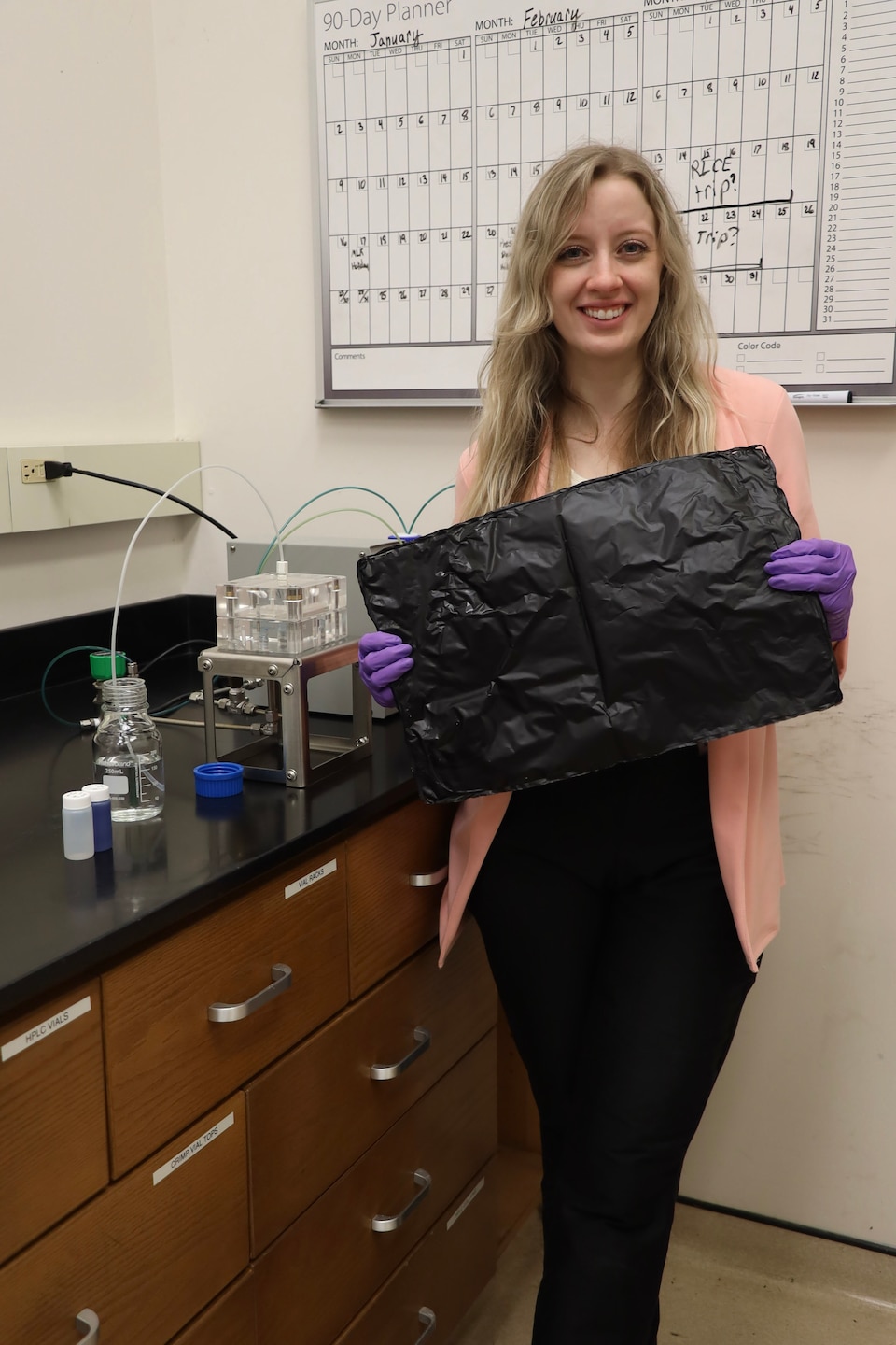 U.S. Army Engineer Research and Development Center (ERDC) researcher, Sarah Grace Zetterholm, displays a graphene mat that can be used as a membrane in water filtration systems or as an absorbent to pull toxins out of water. (U.S. Army Corps of Engineers photo)