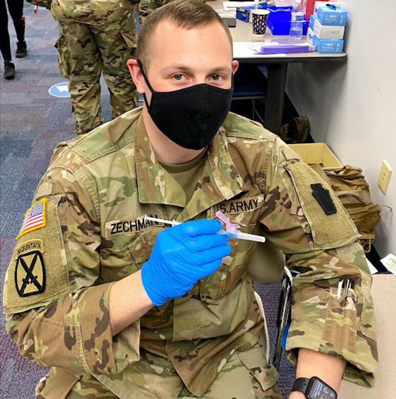 Spc. Matt Zechman, a medic with Headquarters and Headquarters Company, 2-104th General Support Aviation Battalion, from Cleona, Pa., poses while supporting a COVID-19 vaccination clinic in Enola, Pa., in March 2021. (Courtesy photo)