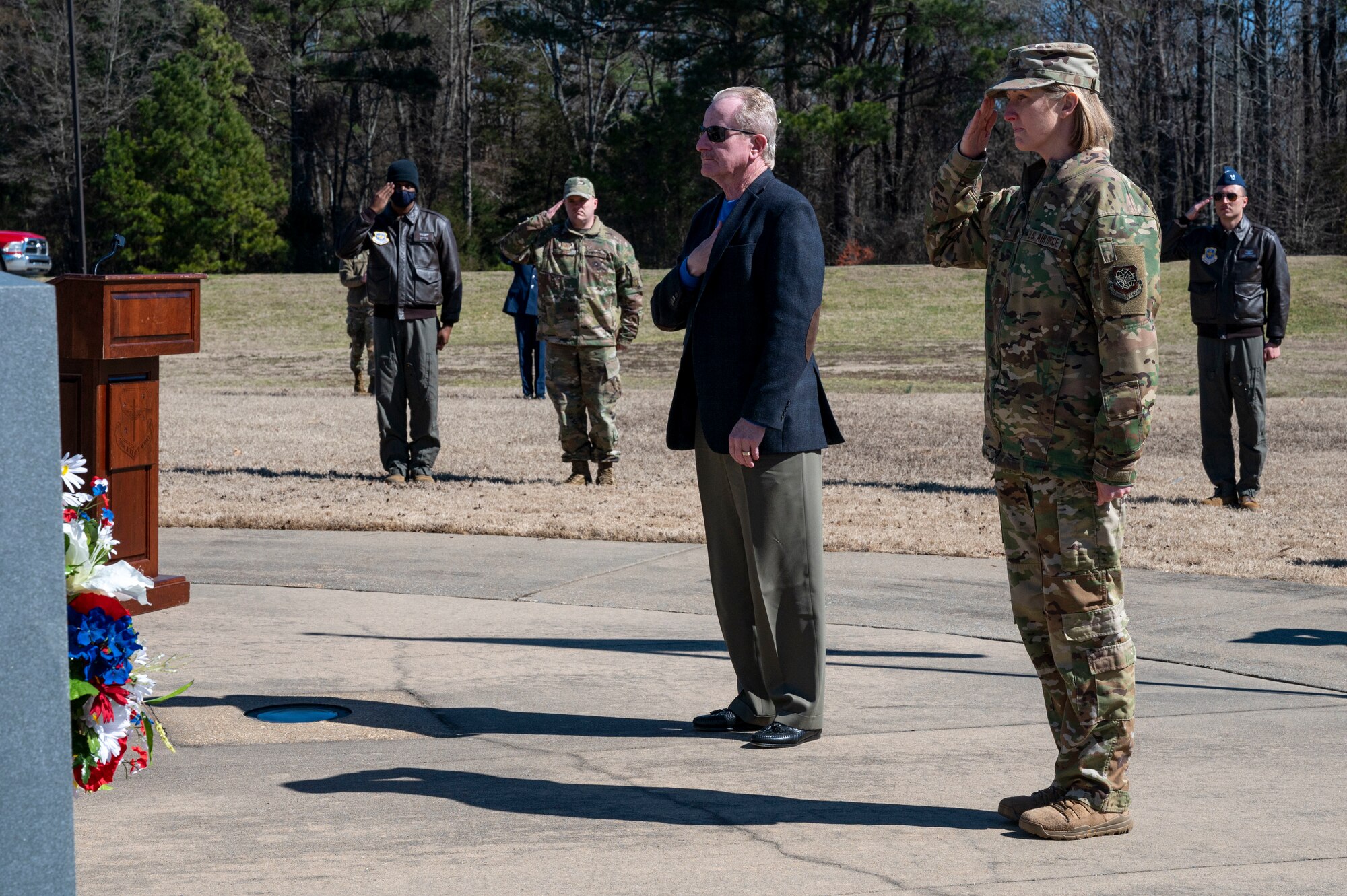 Airmen assigned to the 19th Airlift Wing attend a wreath laying ceremony
