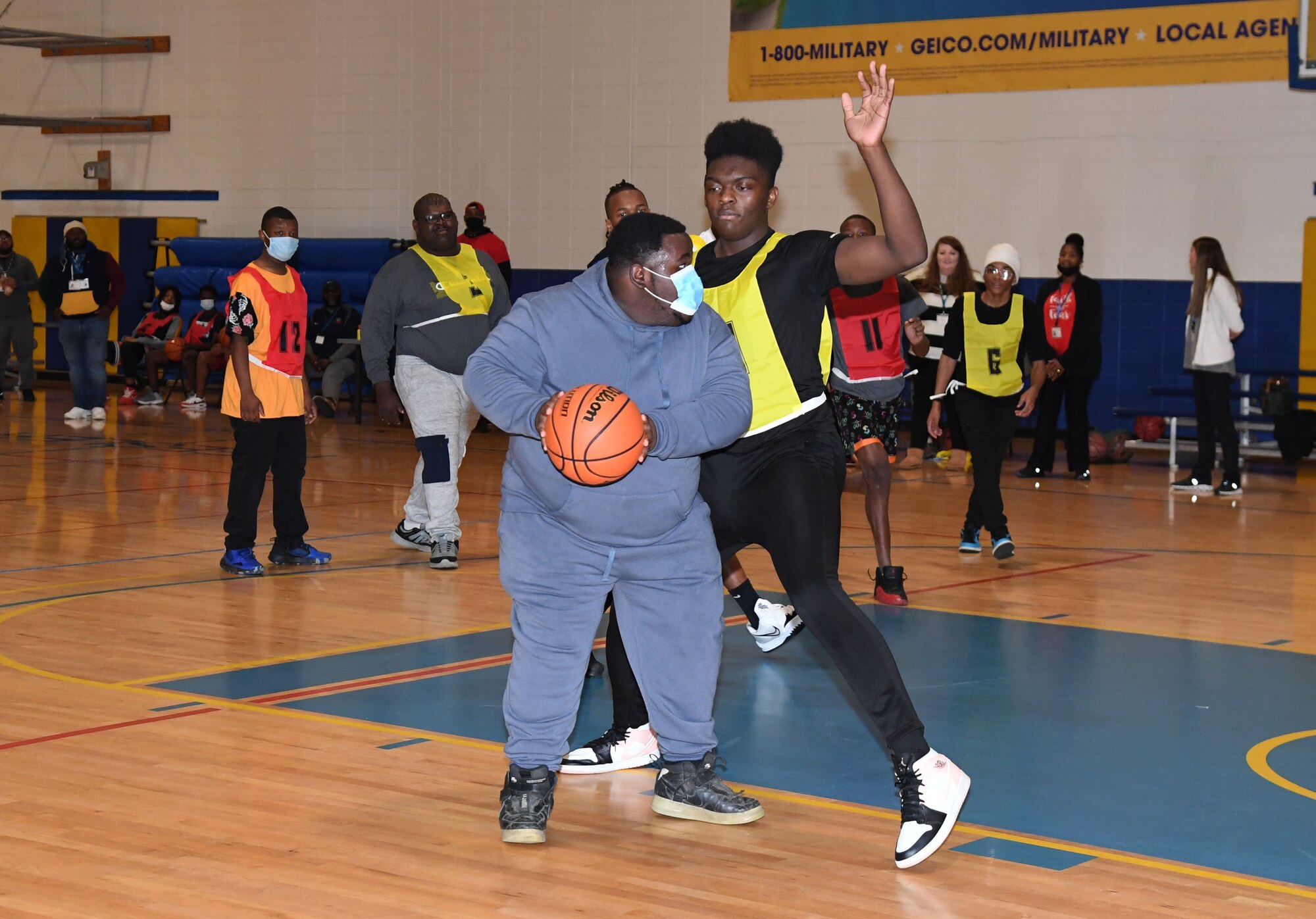 Special Olympics Mississippi athletes participate in a basketball scrimmage during the 2022 USA Games Training Camp inside Blake Fitness Center at Keesler Air Force Base, Mississippi, Feb. 19, 2022. The training camp was held to prepare the athletes for the 2022 Special Olympics USA Games that are held in Orlando, Florida, June 5-12. This is the first time that Keesler has hosted the event. (U.S. Air Force photo by Kemberly Groue)