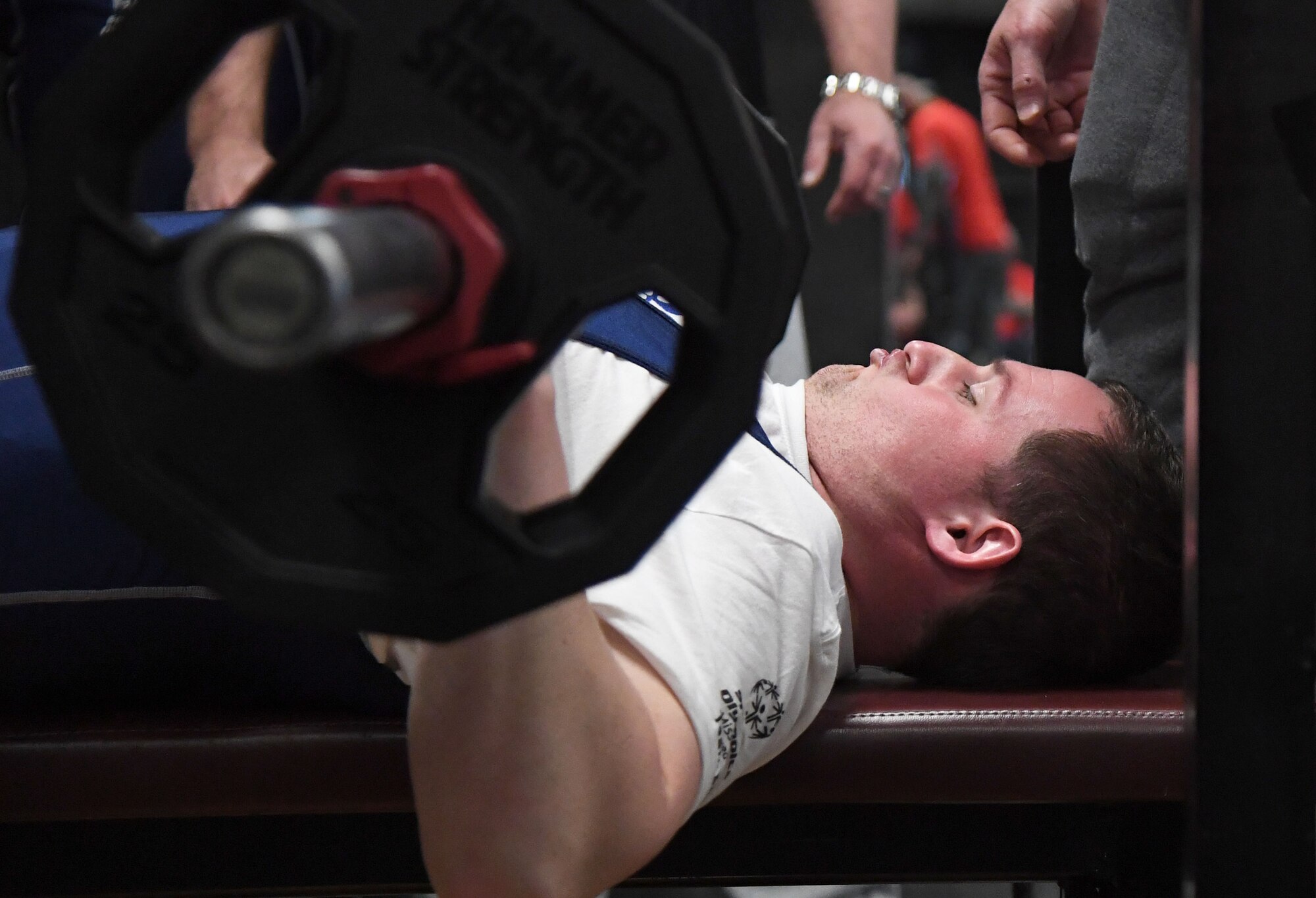 Seth Slocum, Special Olympics Mississippi athlete, participates in a powerlifting training session during the 2022 USA Games Training Camp inside the Triangle Fitness Center at Keesler Air Force Base, Mississippi, Feb. 19, 2022. The training camp was held to prepare the athletes for the 2022 Special Olympics USA Games that are held in Orlando, Florida, June 5-12. This is the first time that Keesler has hosted the event. (U.S. Air Force photo by Kemberly Groue)